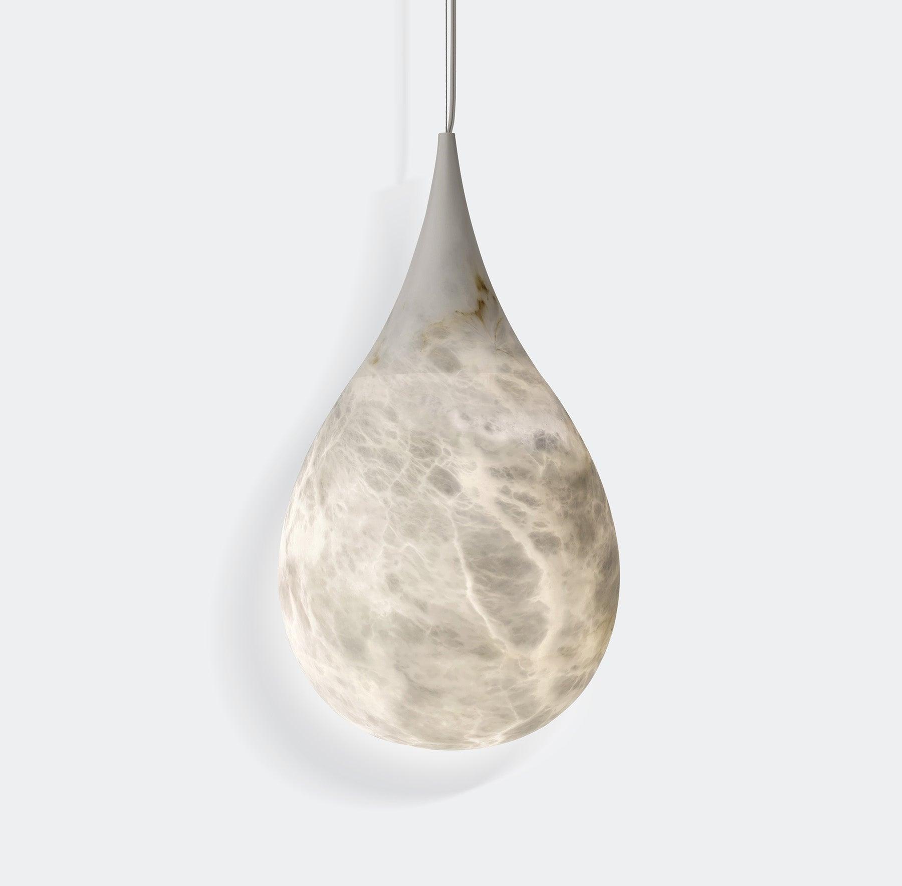Single veined marble pendant suspended from cable