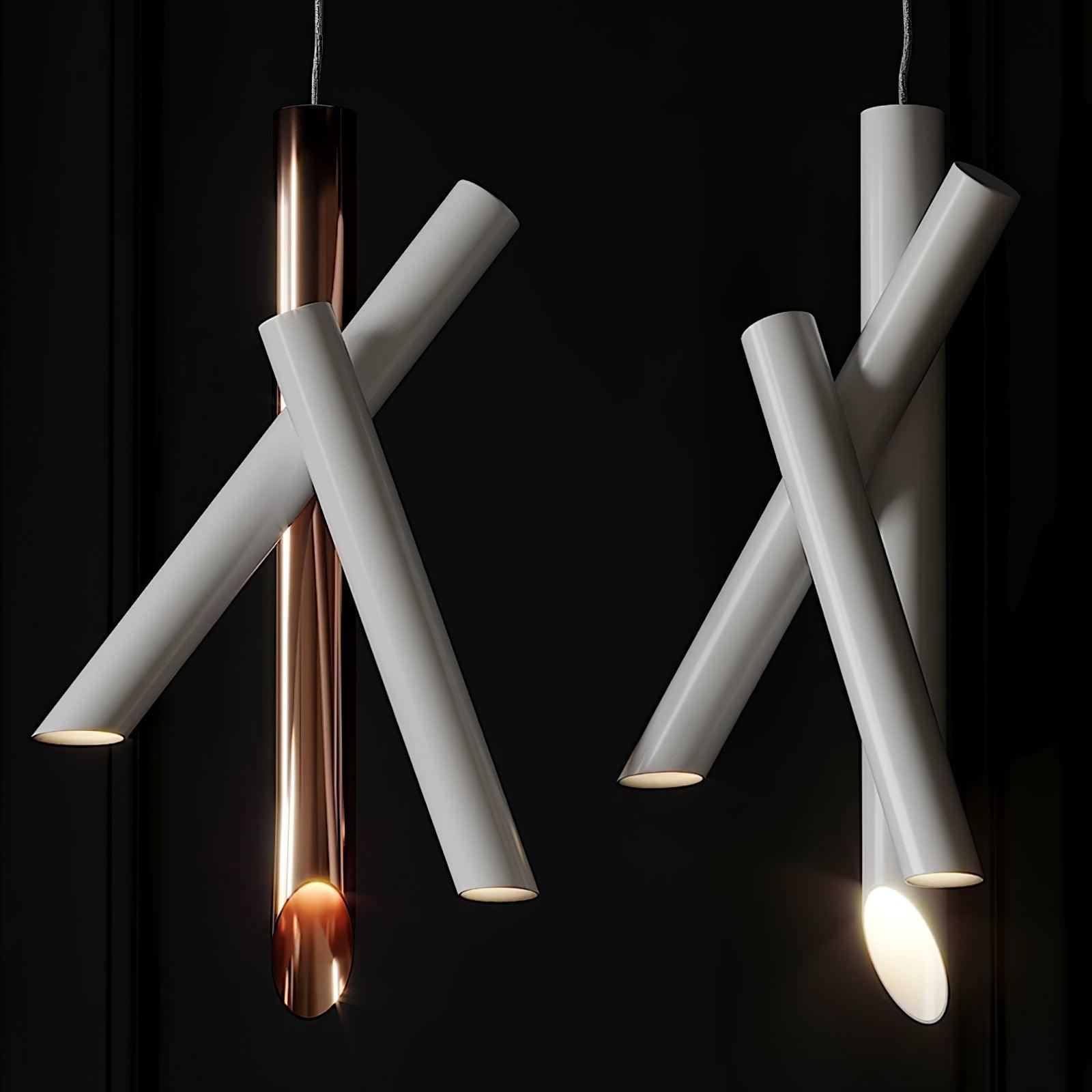 Illuminated white and rose-gold Tubes pendants against a dark background