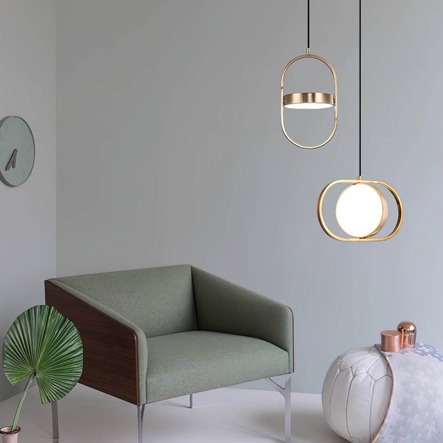 Gold horizontal and vertical KUU pendants beside seating