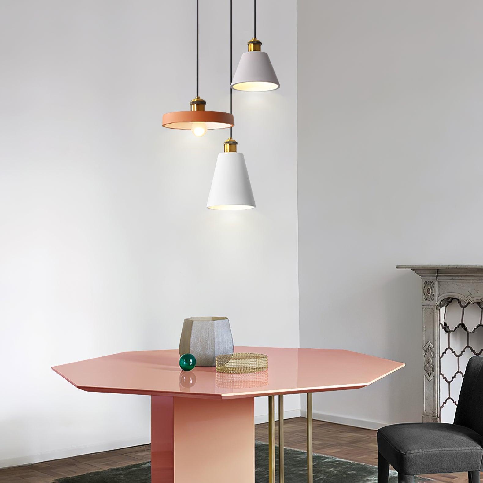 Two shallow pendants and a cone over a table