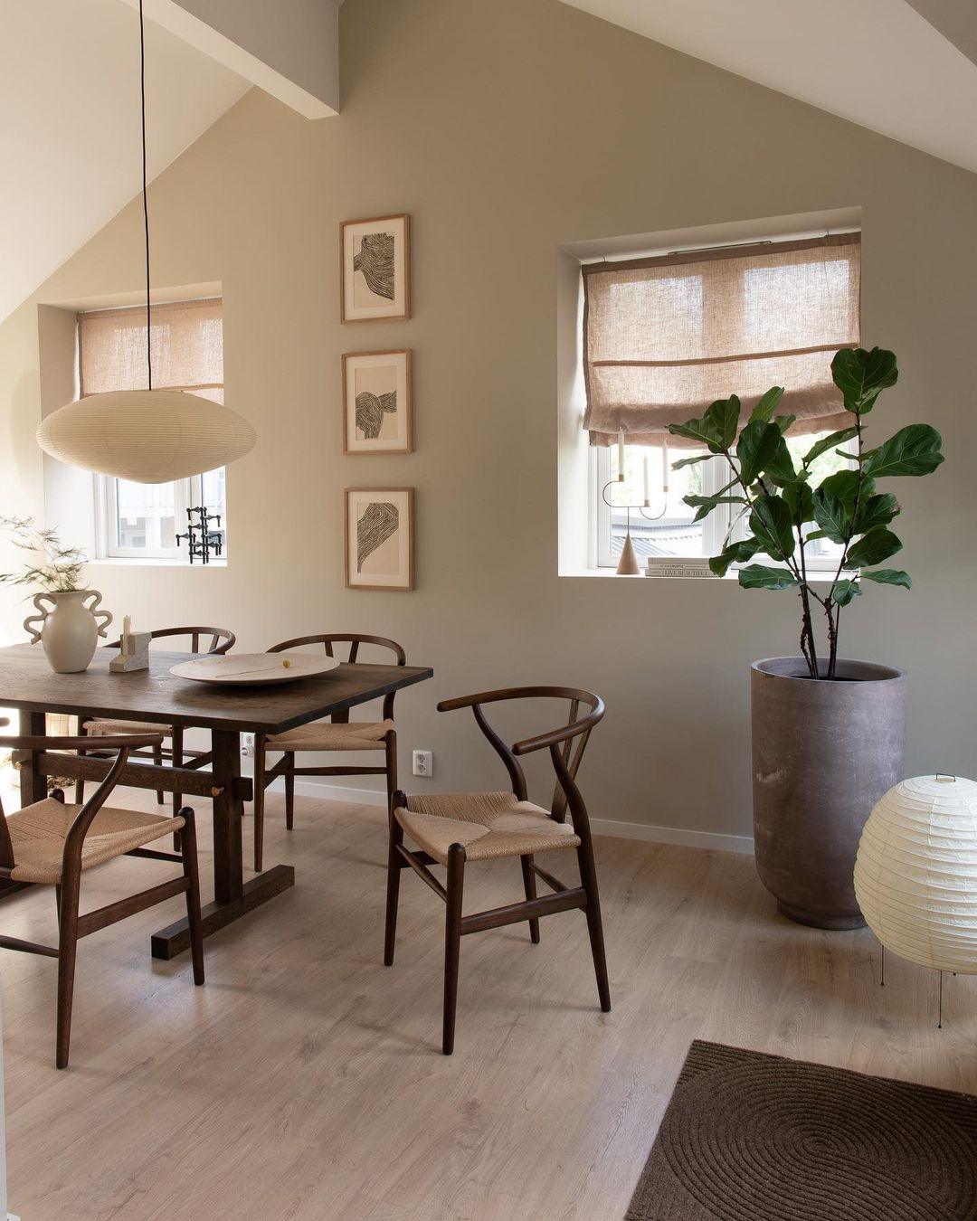 White paper pendant above a round dining table