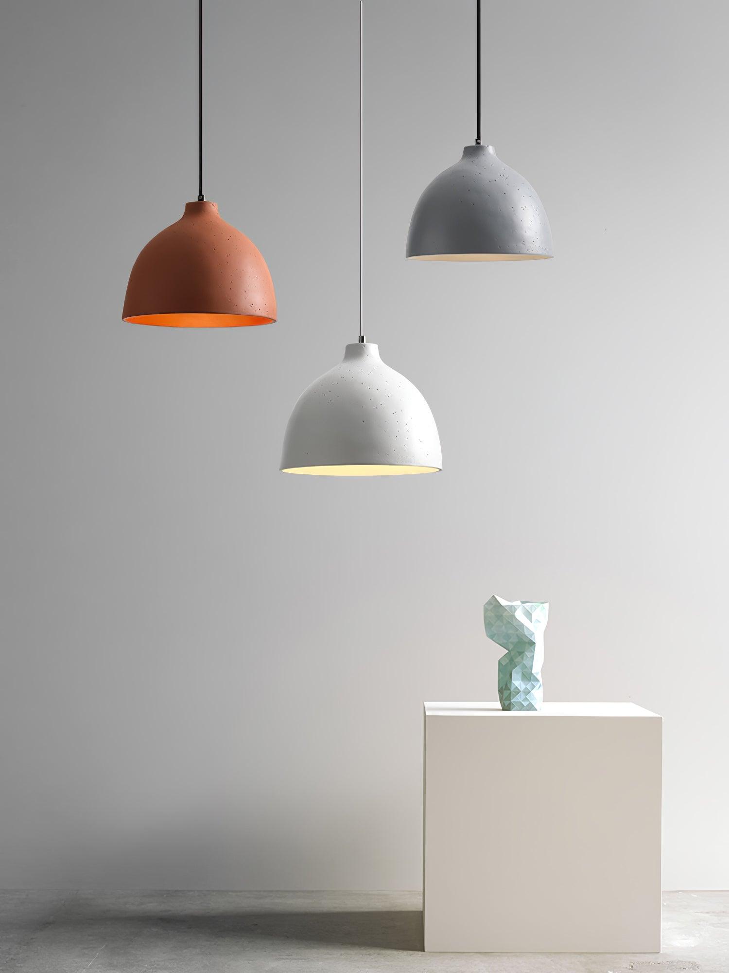 Three shades staggered above a pedestal