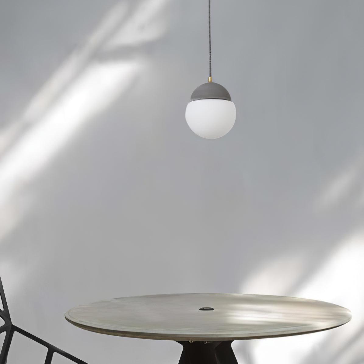 Unlit Grey-capped globe above a round table