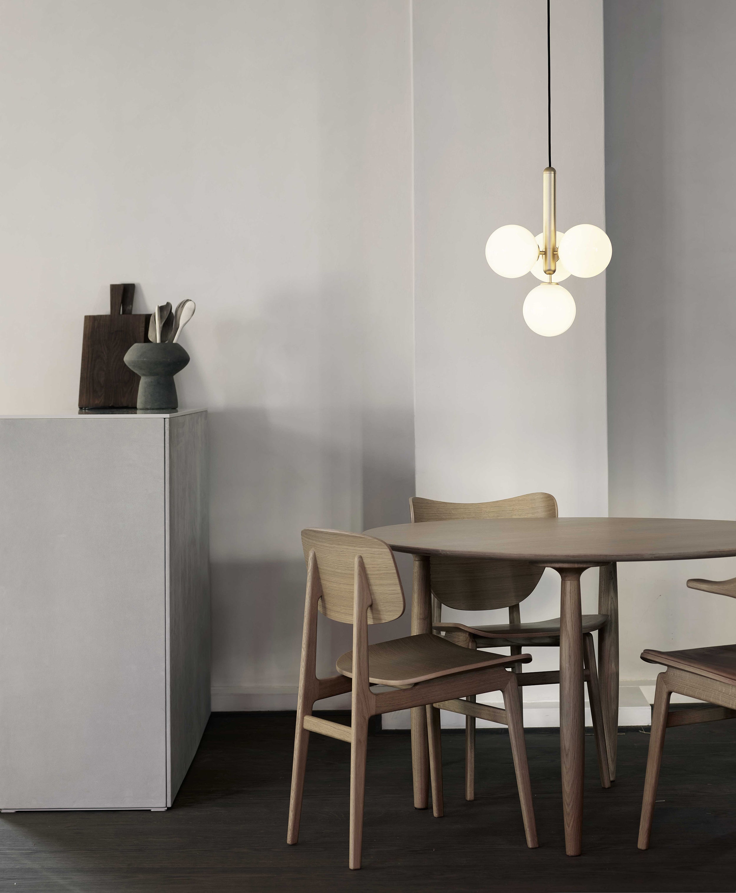 White globe cluster above a small round table
