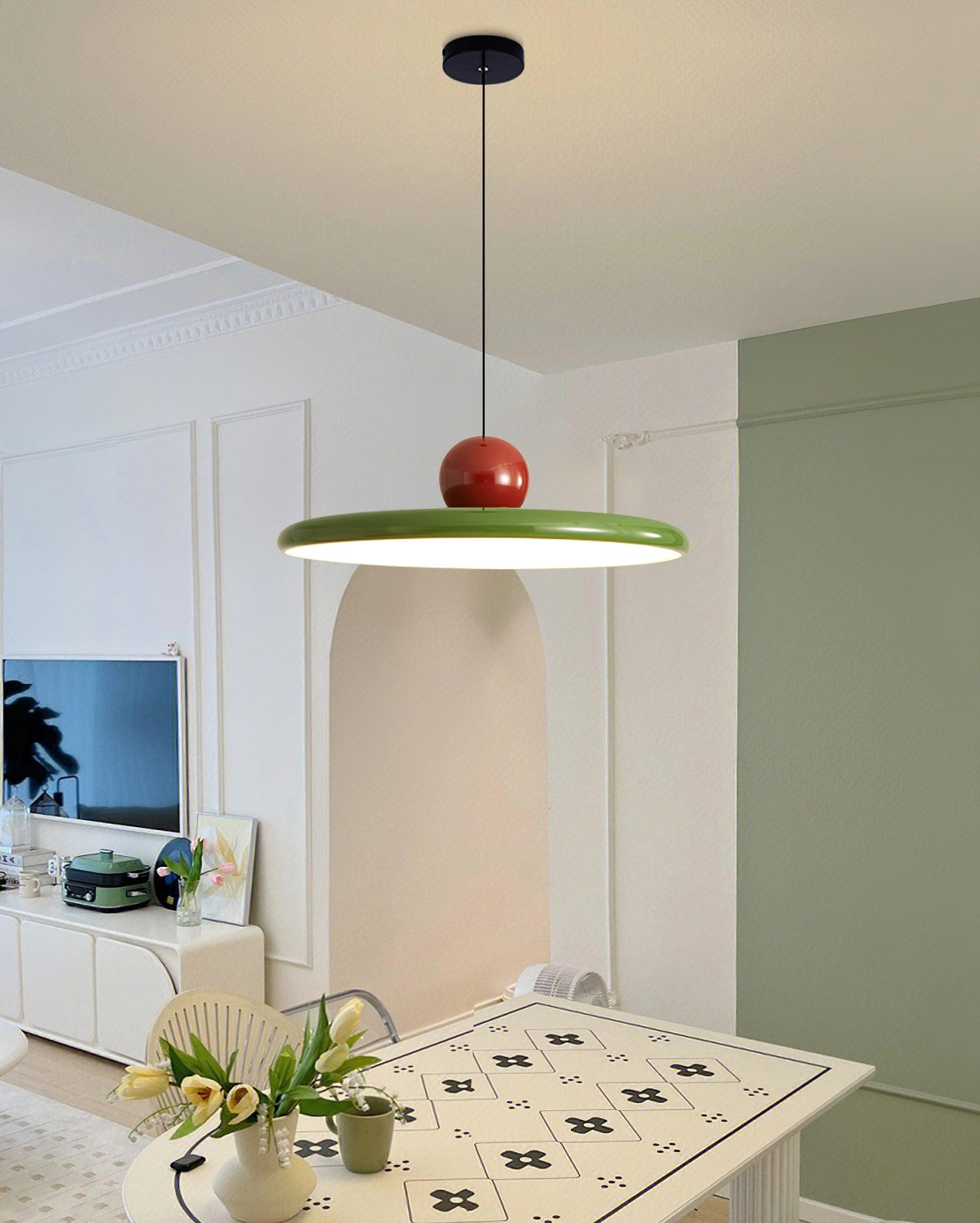 Lola pendant showing dark canopy and cable above a room table