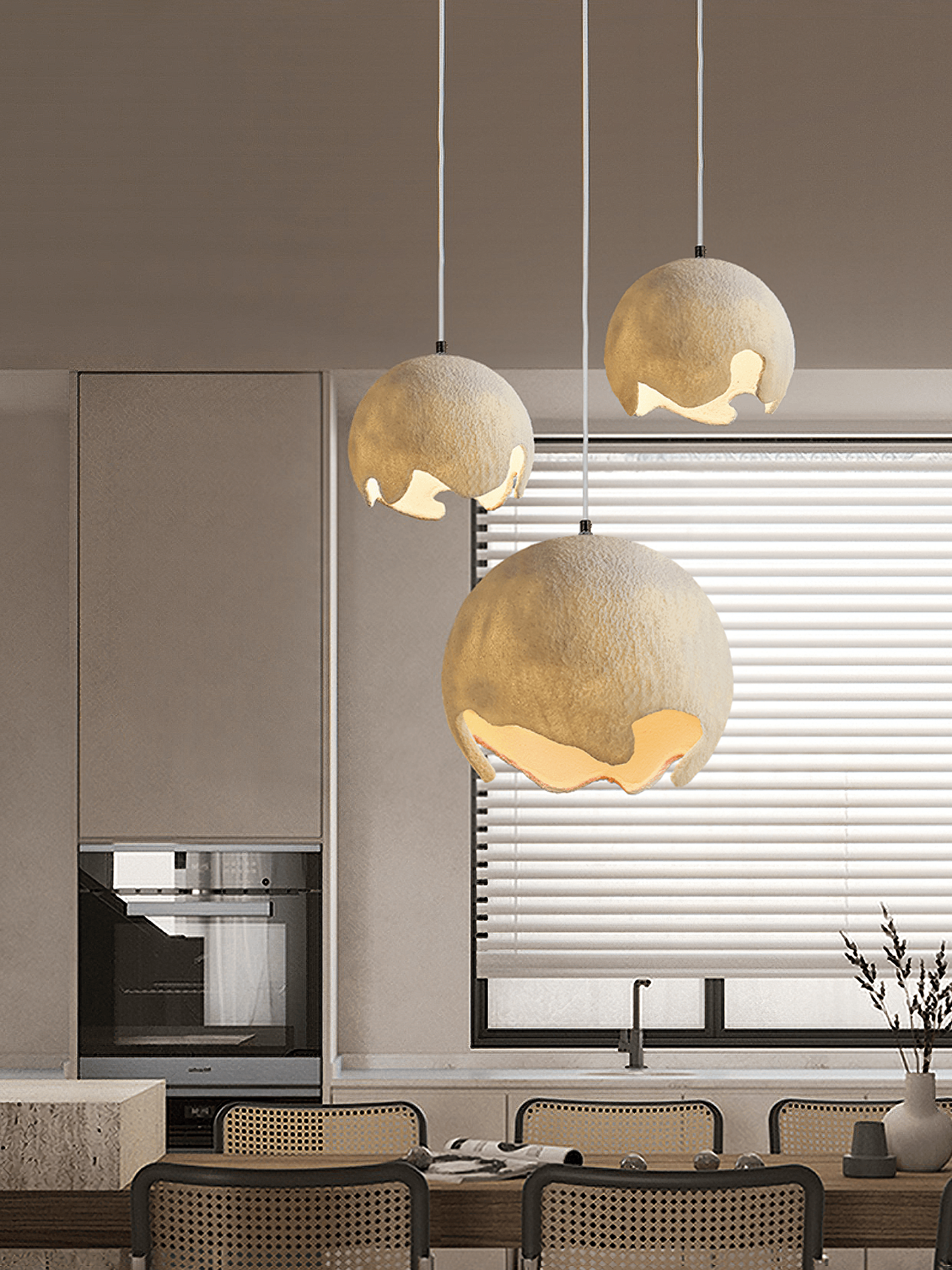 Textured beige pendants above a kitchen island