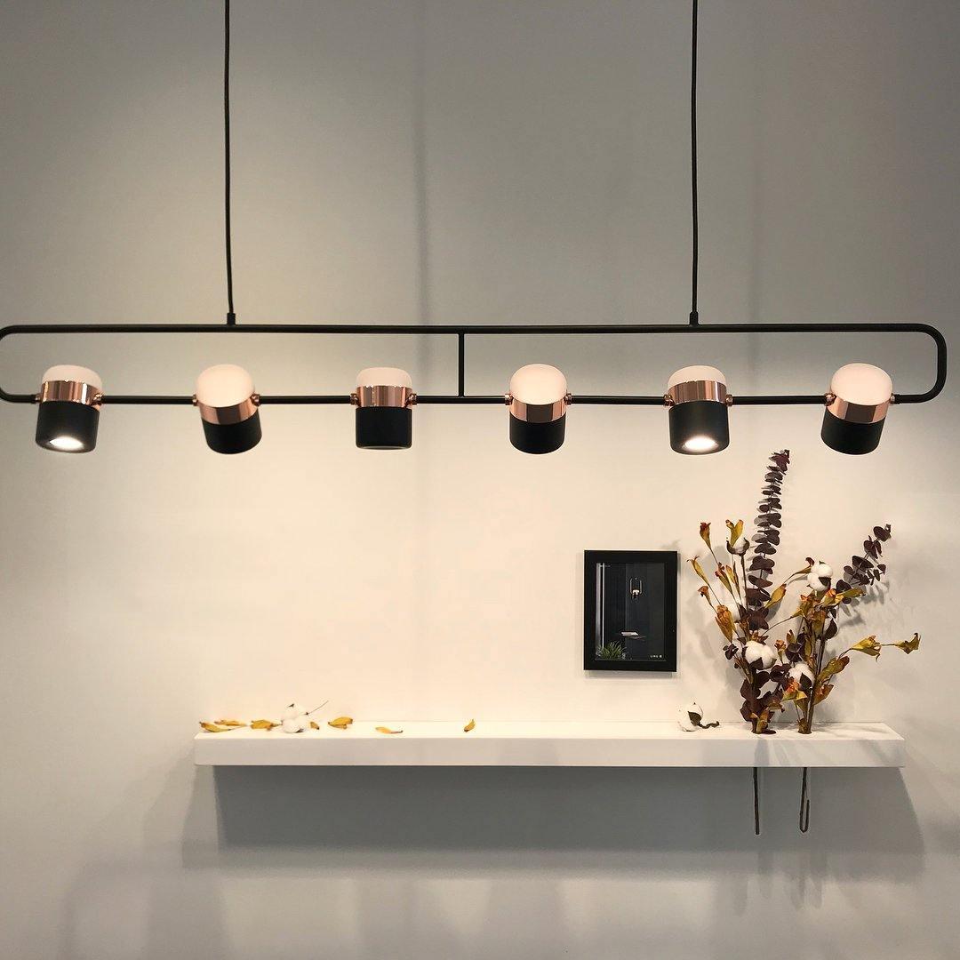 Geometric LED pendant light with adjustable cylindrical heads