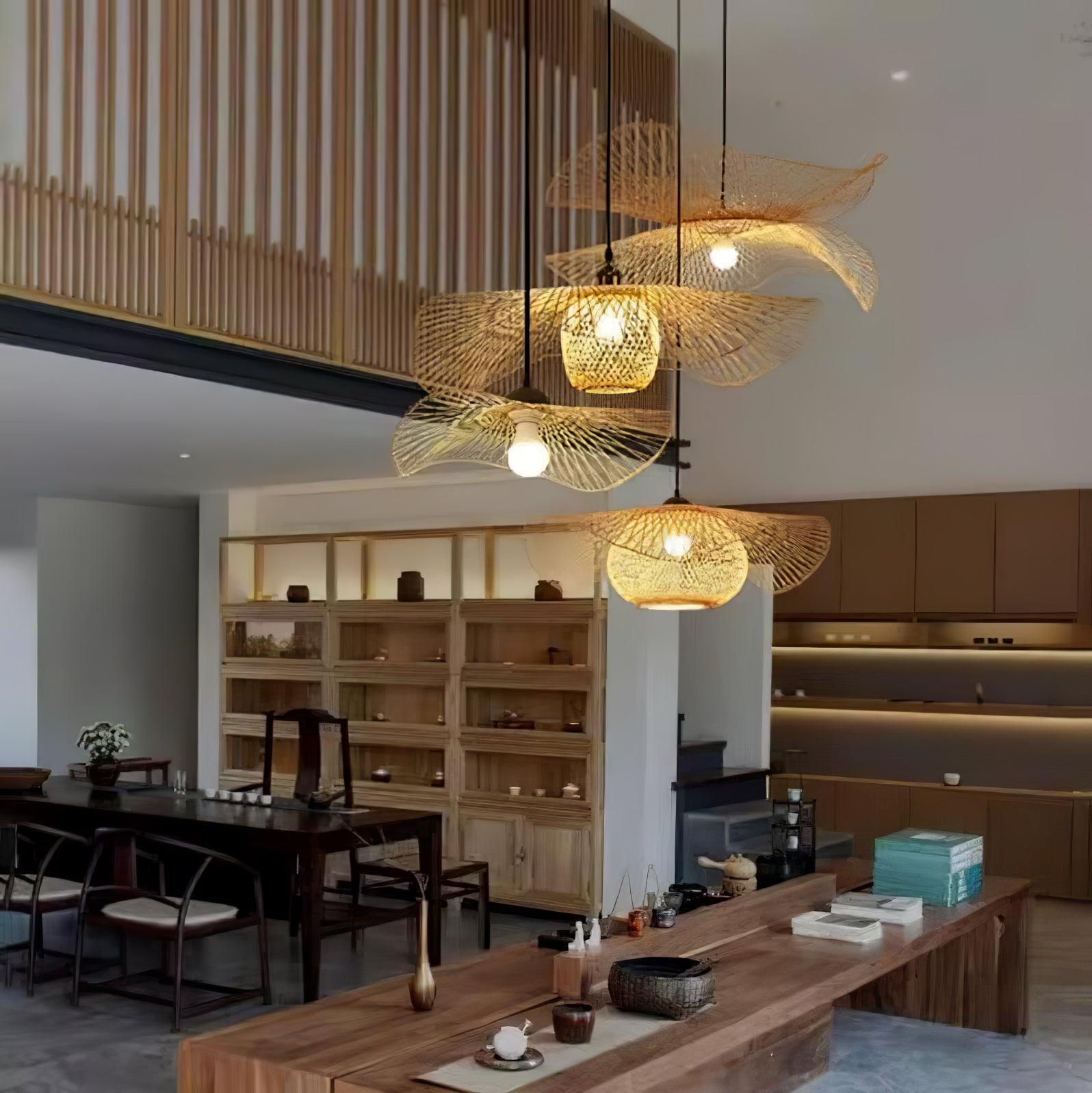 Bamboo pendants arranged above a long dining table