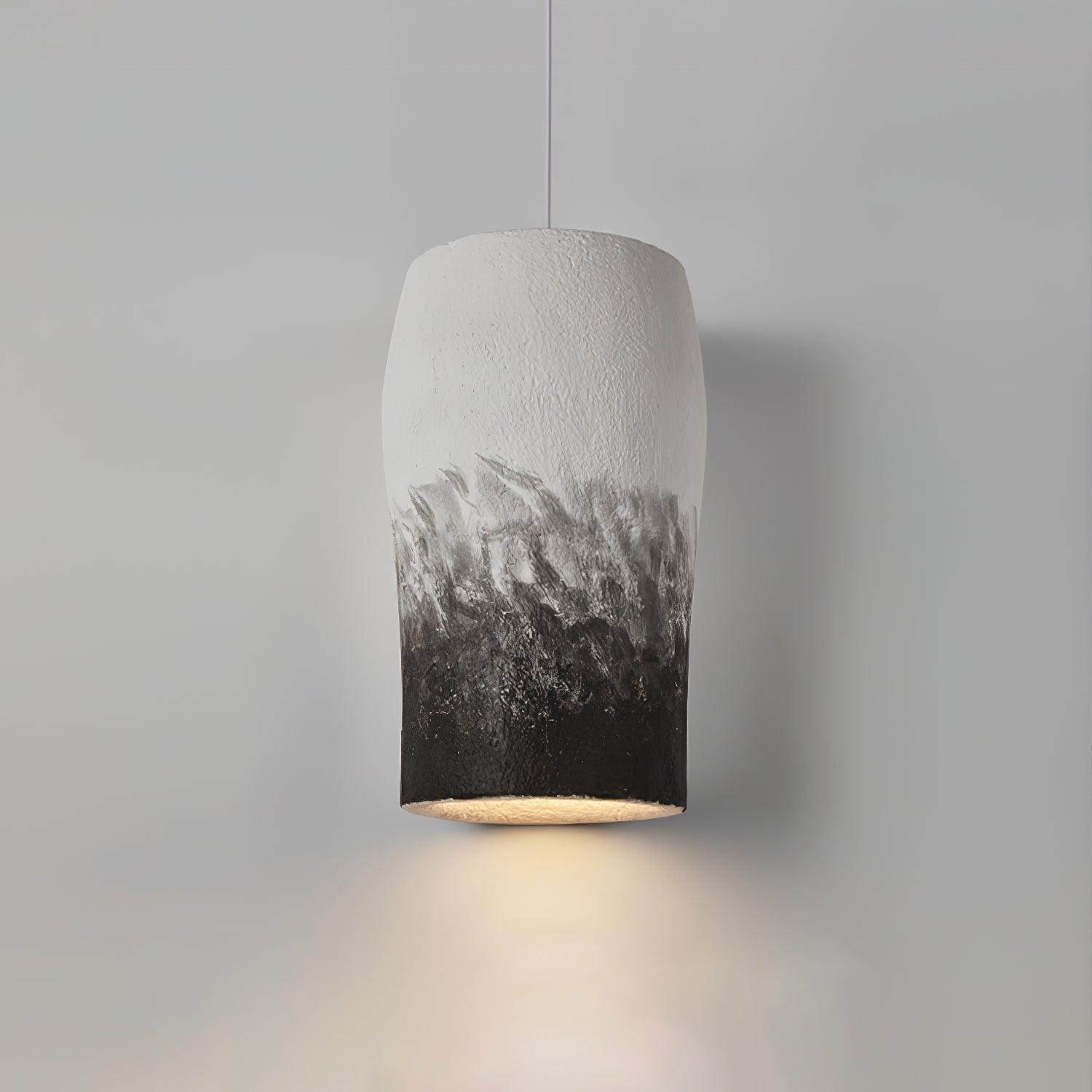 Textured pendant with light visible beneath its dark rim