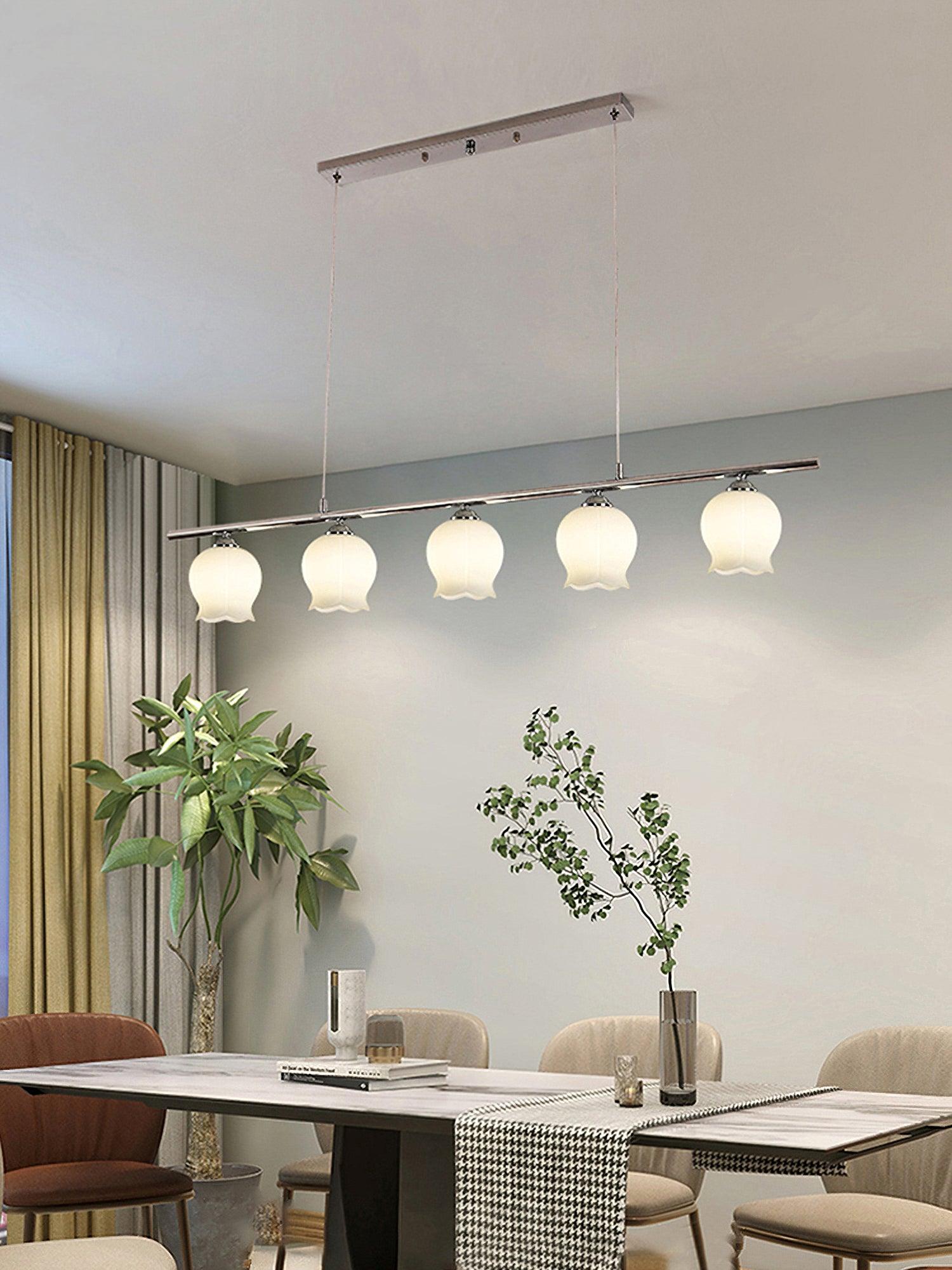 Floral Glass five-head chrome bar suspended above a table