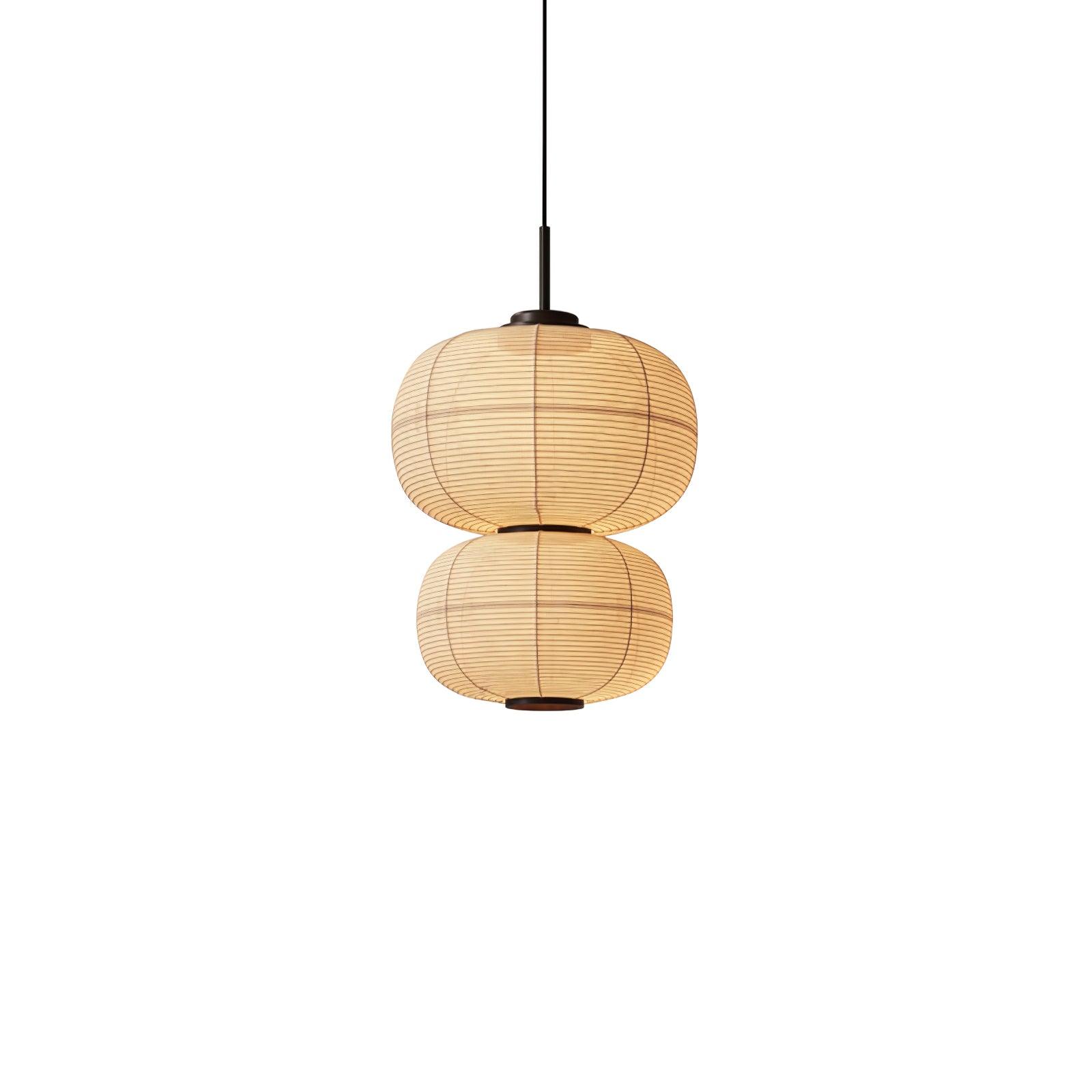 Model A two stacked rounded fabric shade sections with dark central waist, black suspension and lower opening