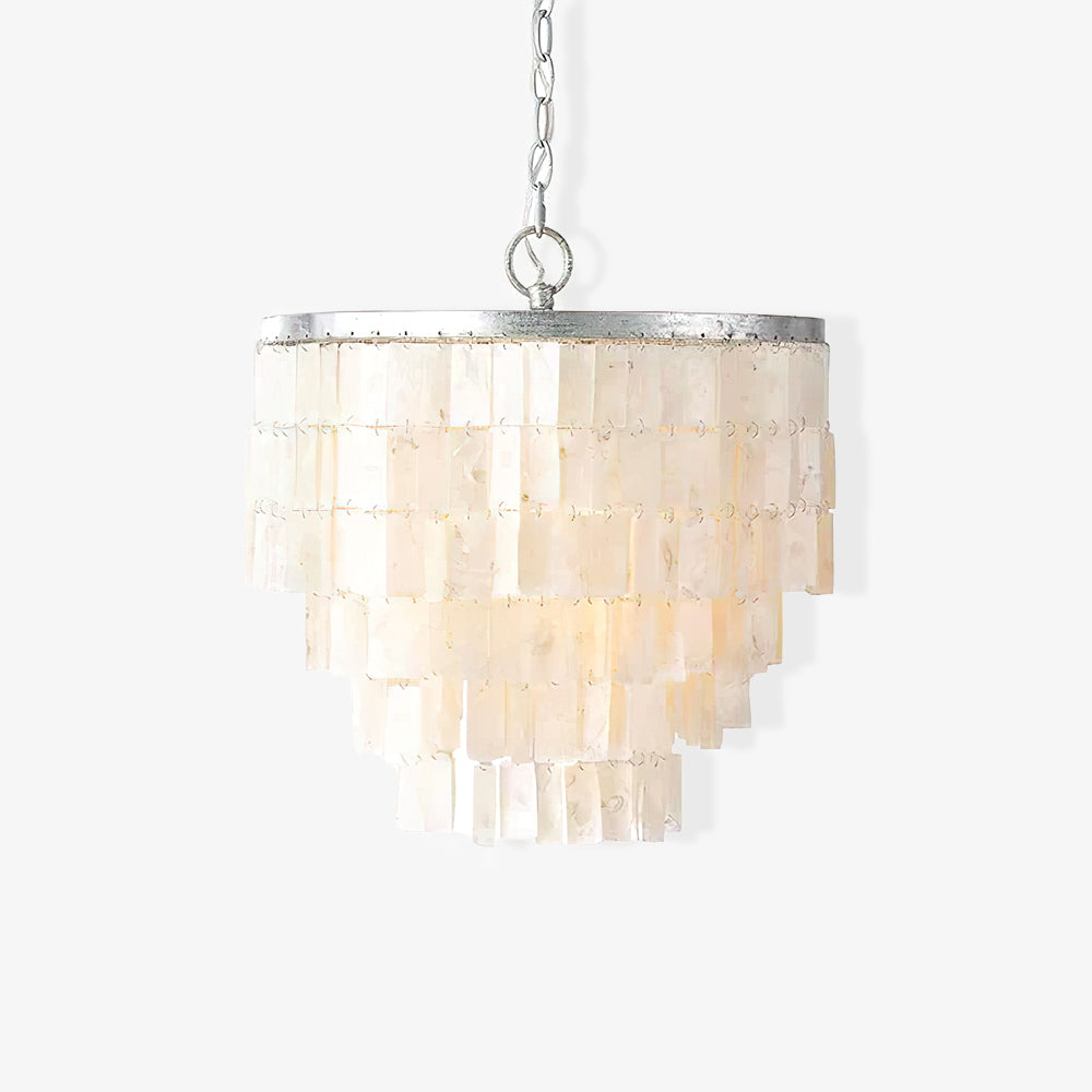 Lit rectangular shell pendant with narrowing lower tiers, silver top ring and chain against a white wall