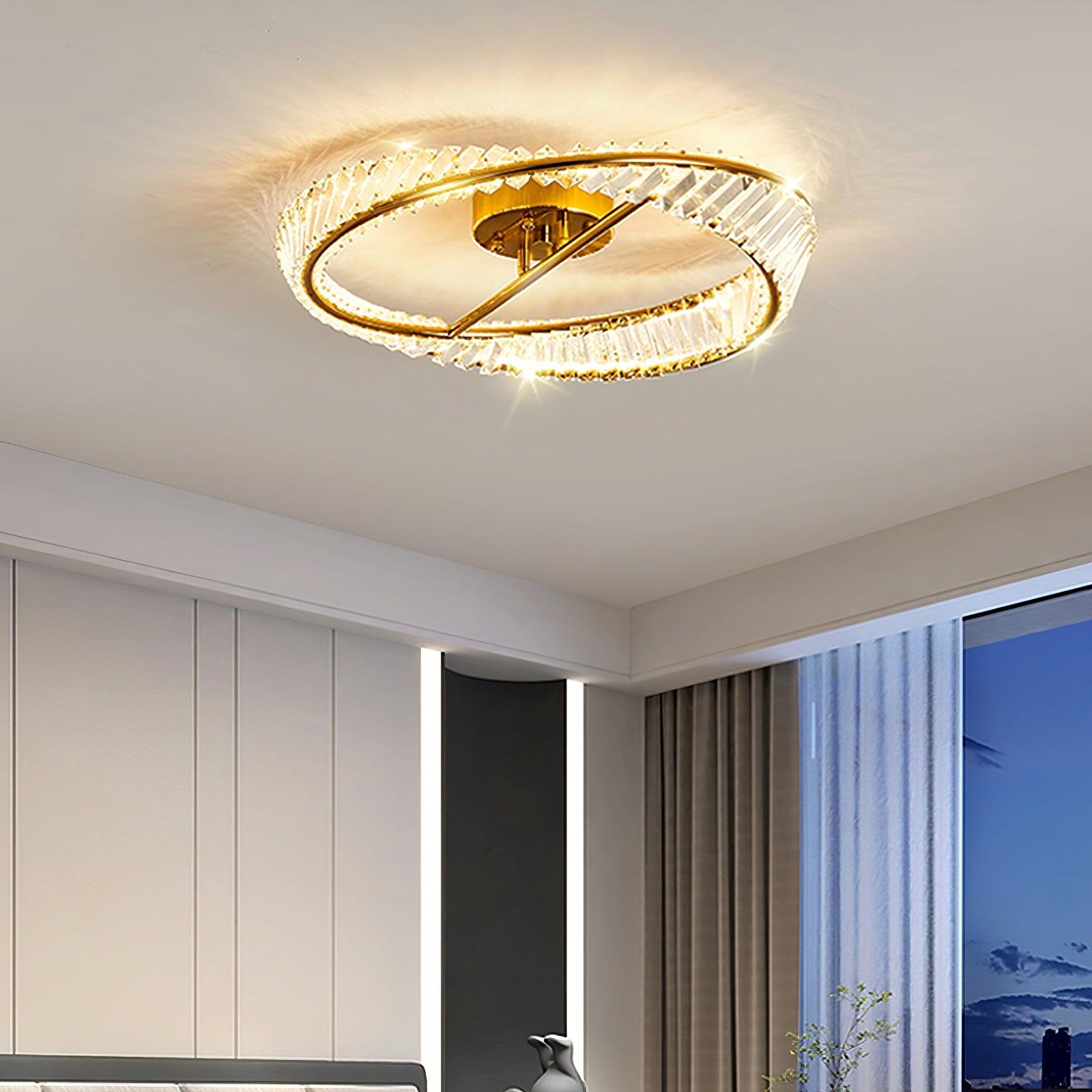 Gold-tone glass ring light near a bedroom ceiling corner and window curtains