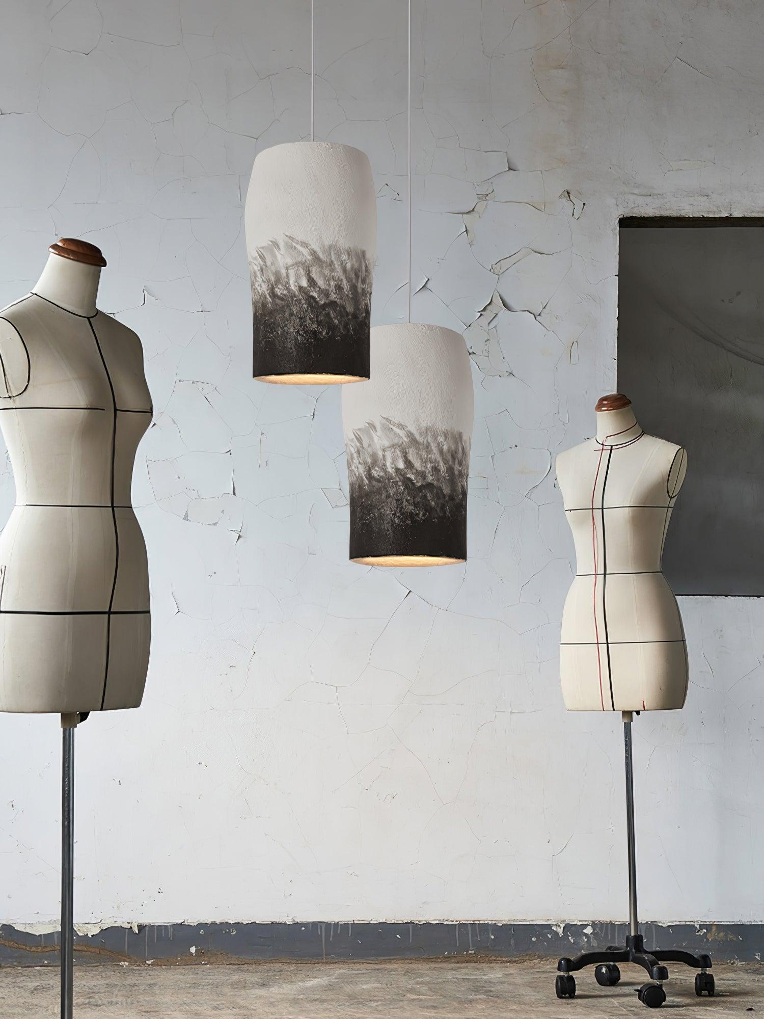 Two Crust Thin pendants in a room with dress forms