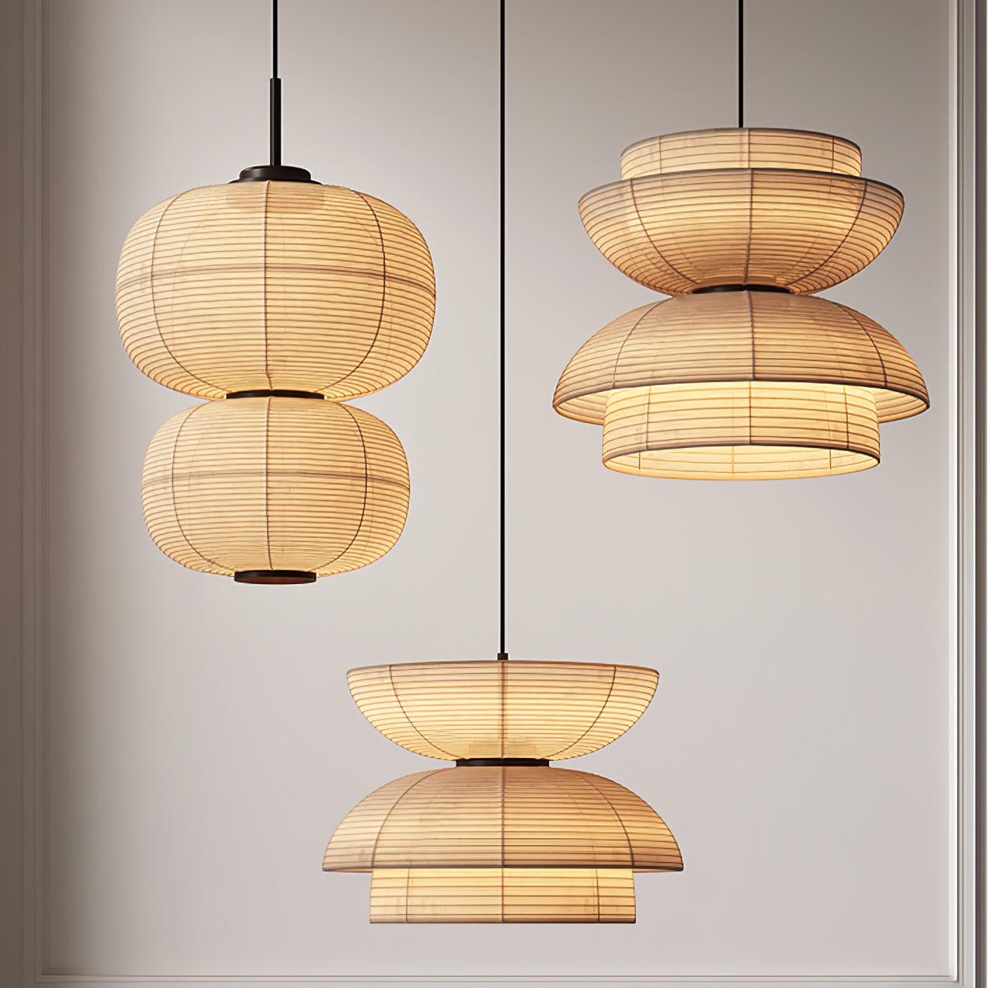Three separate fabric pendants showing stacked twin ovals and two opposed bowl-and-dome forms against a panelled wall