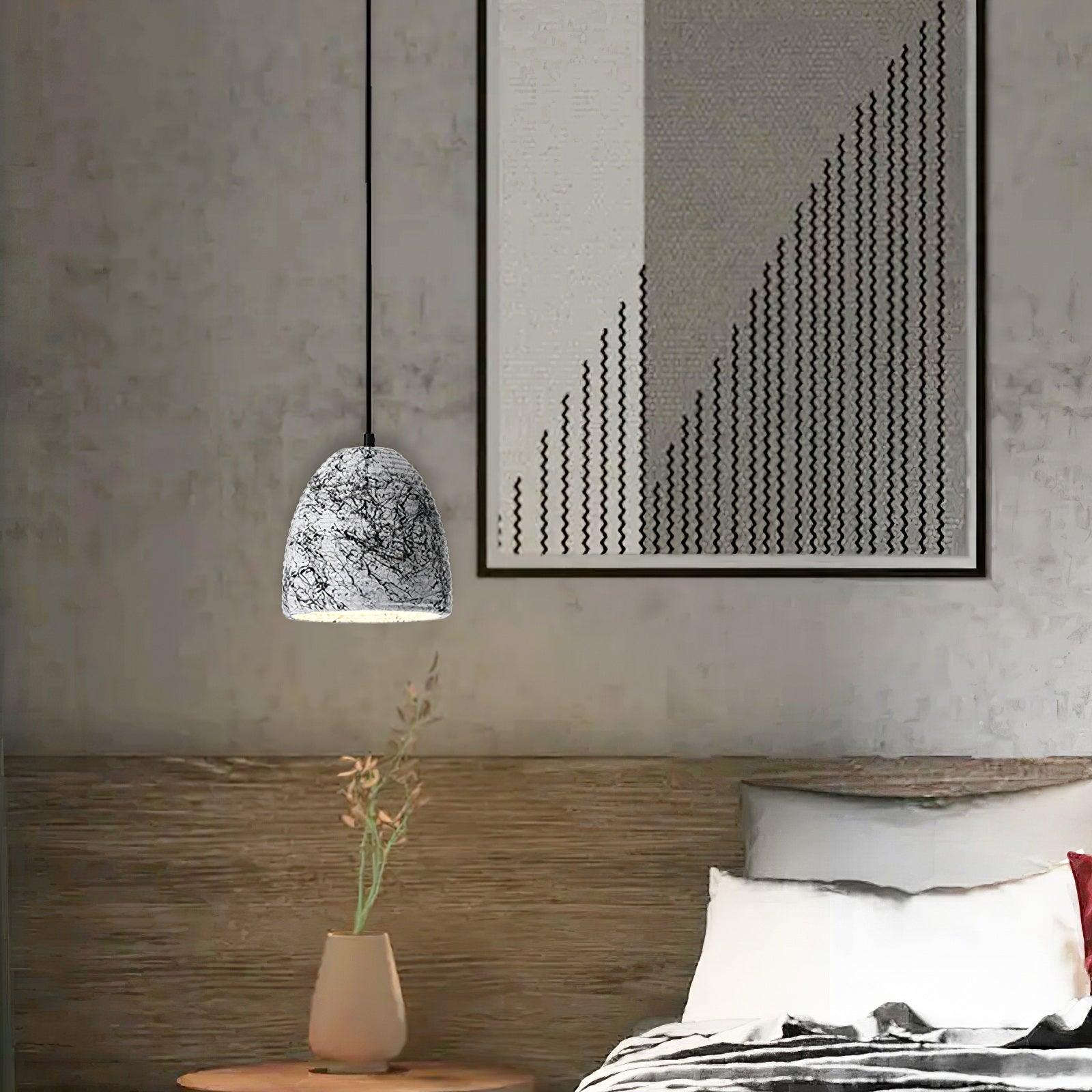 Patterned rounded cement shade in a bedroom