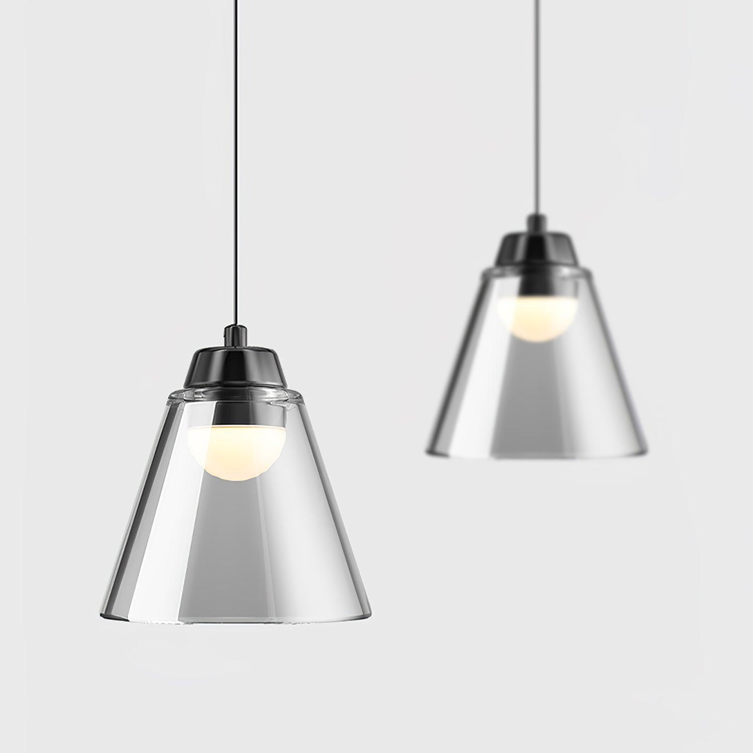 Two clear cone pendants hanging at different heights