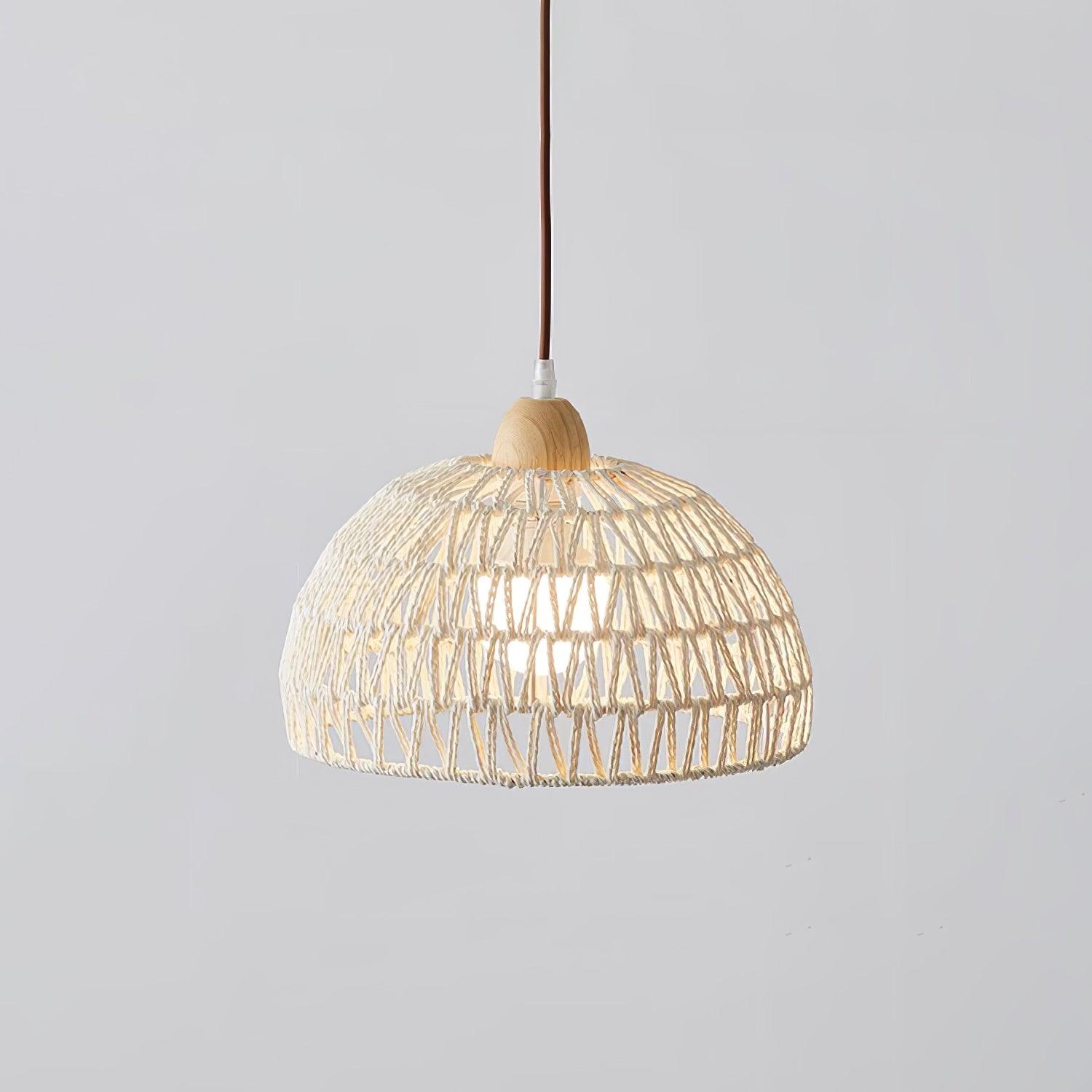 Closer isolated lit open-weave dome with a wood-grain cap and brown suspension against gray