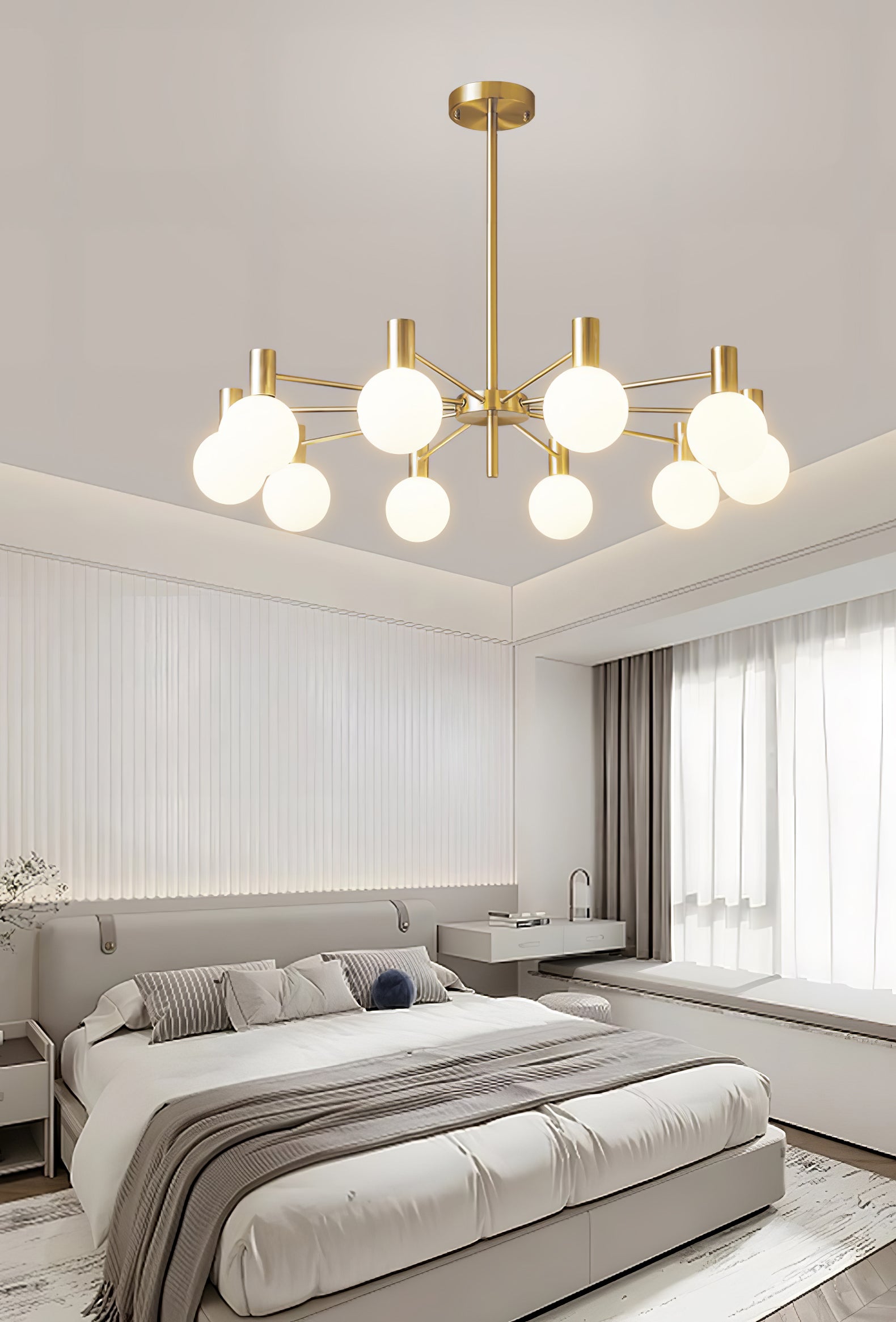 Ten-white-globe chandelier above a pale bed with striped pillows, bedside lamps, ribbed wall and broad window.