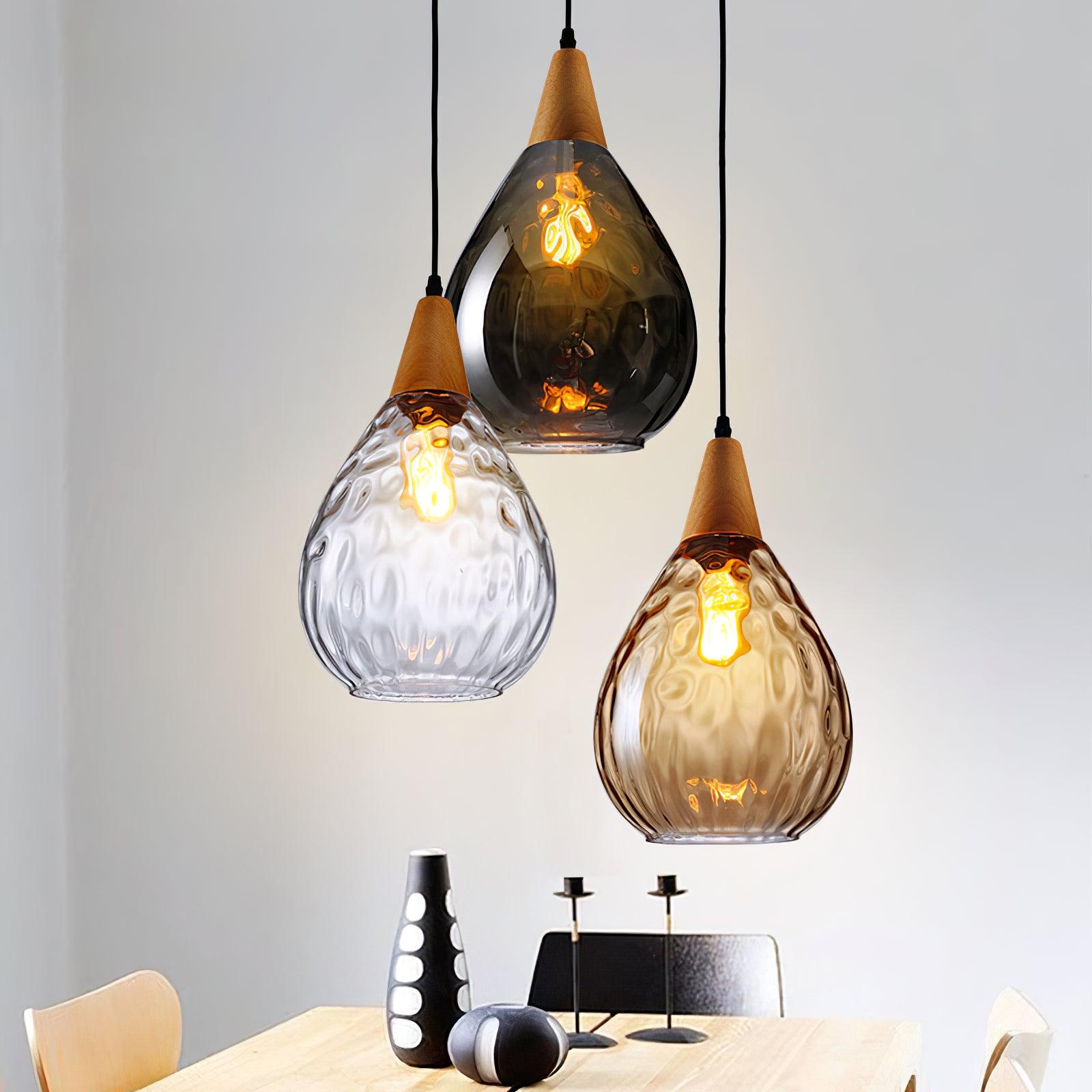 Mixed glass Besnier pendants above a table