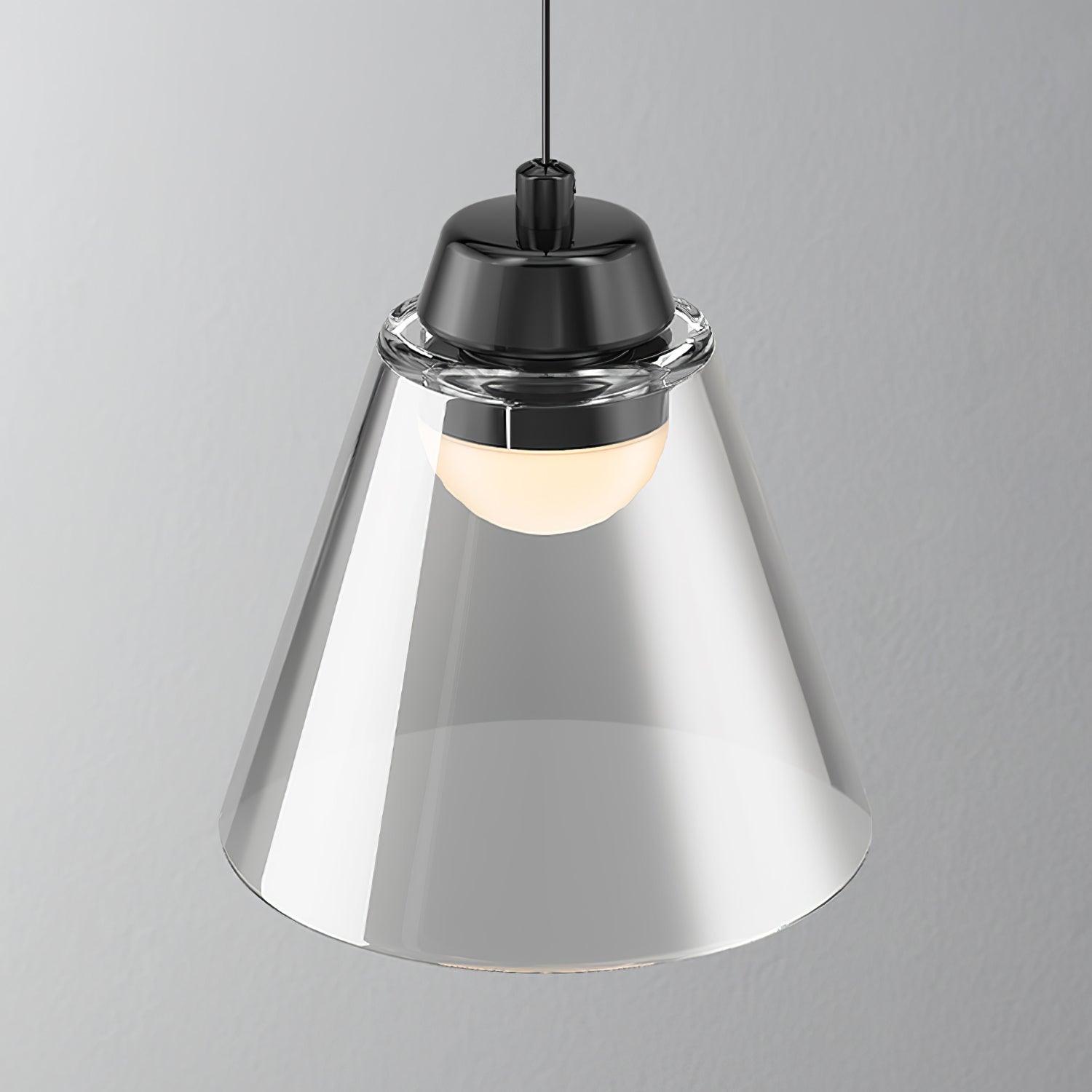 Close-up of transparent conical shade and rounded light beneath Black cap