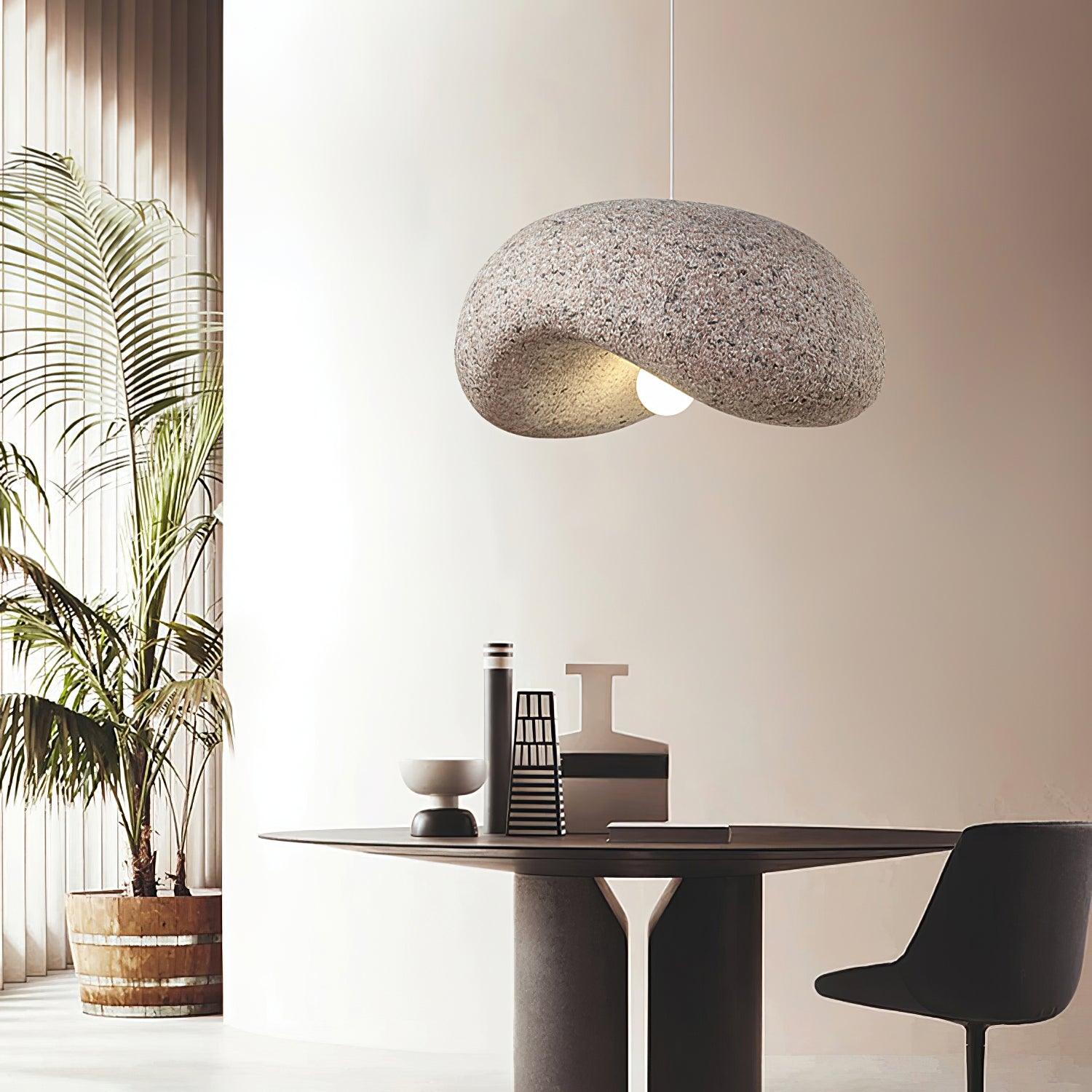 Pink textured pendant above a table
