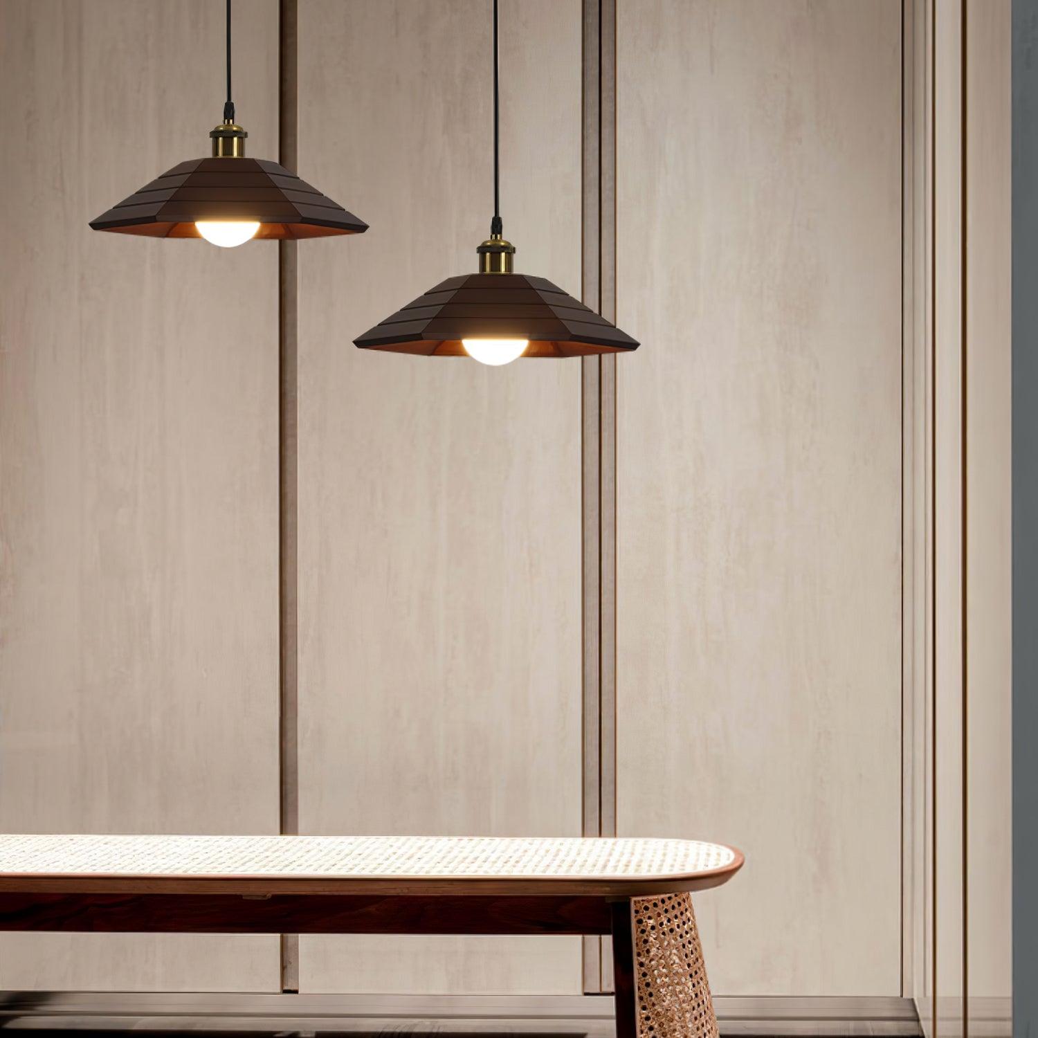 Two dark wood umbrella shades at staggered heights above a woven-topped bench against wood wall panels