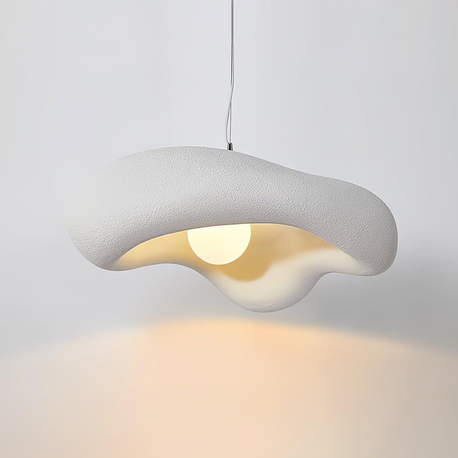 White Lumina pendant with a textured wavy rim and a glowing round centre