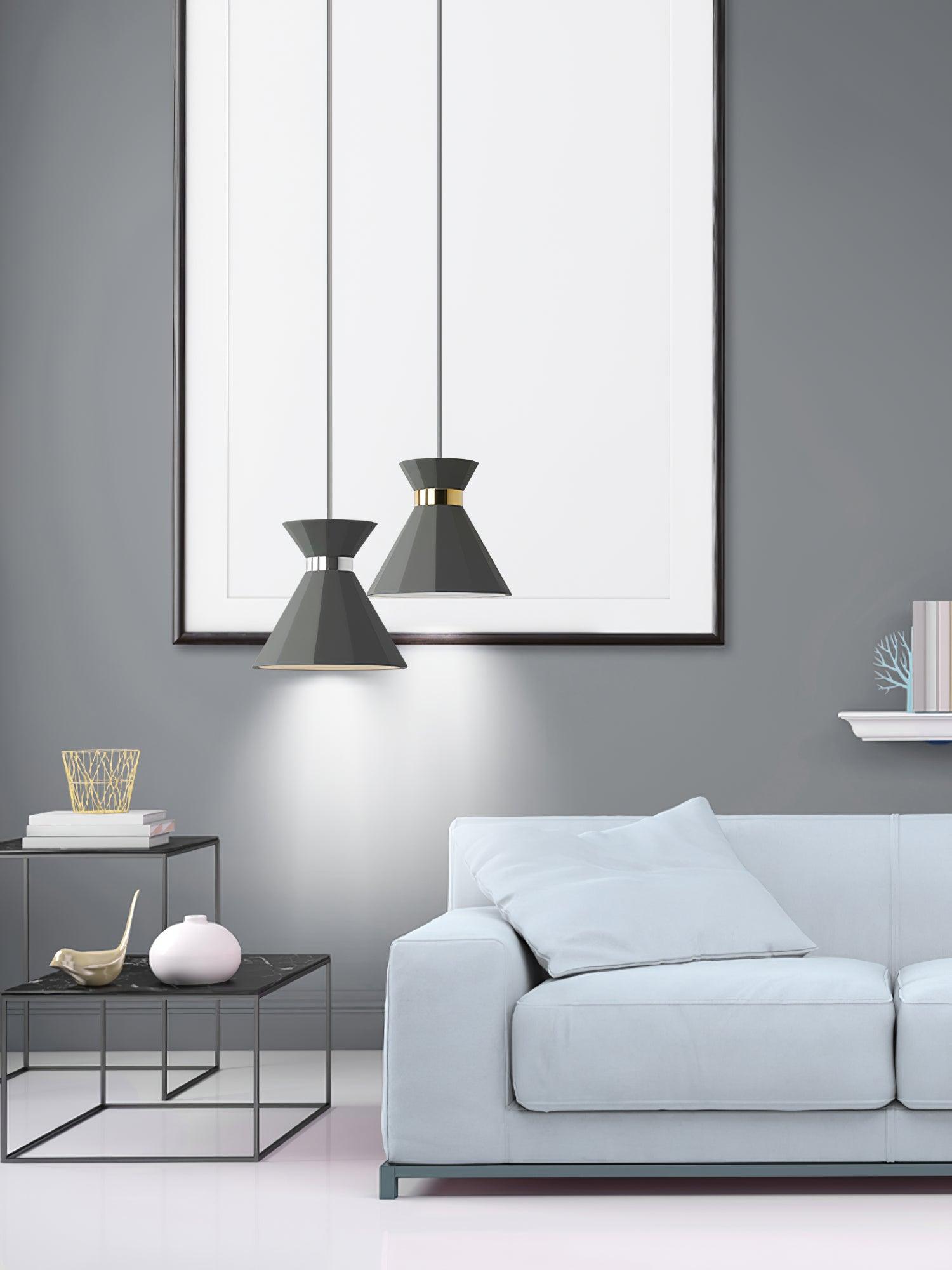 Grey and gold pendants next to a sofa