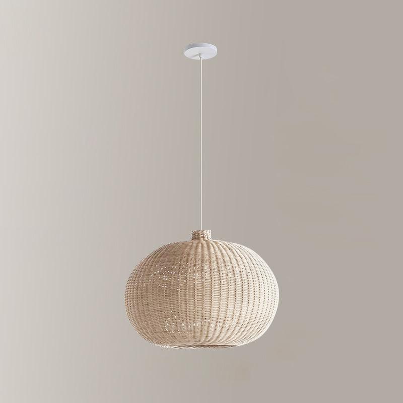 Pale rounded rattan shade with light canopy and cord
