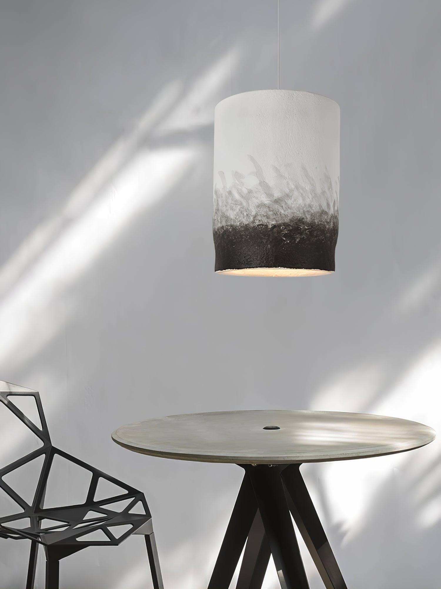 Two-tone textured pendant in a bright dining corner