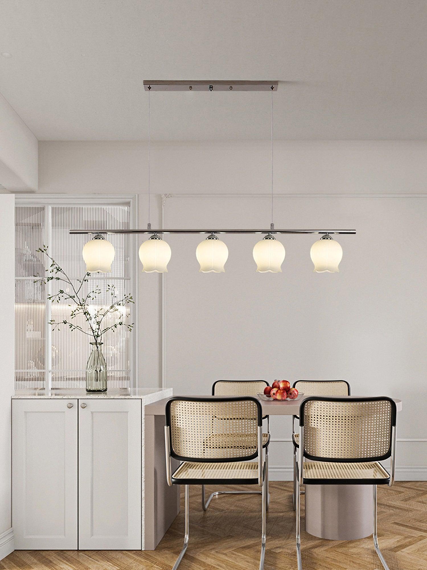 Floral Glass five-head straight pendant over a dining arrangement