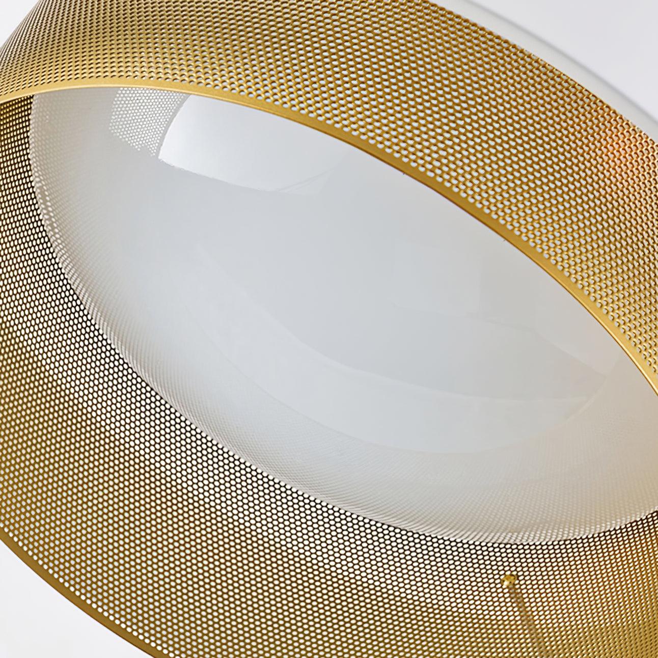 Underside close view of gold-tone perforated shade and central white diffuser