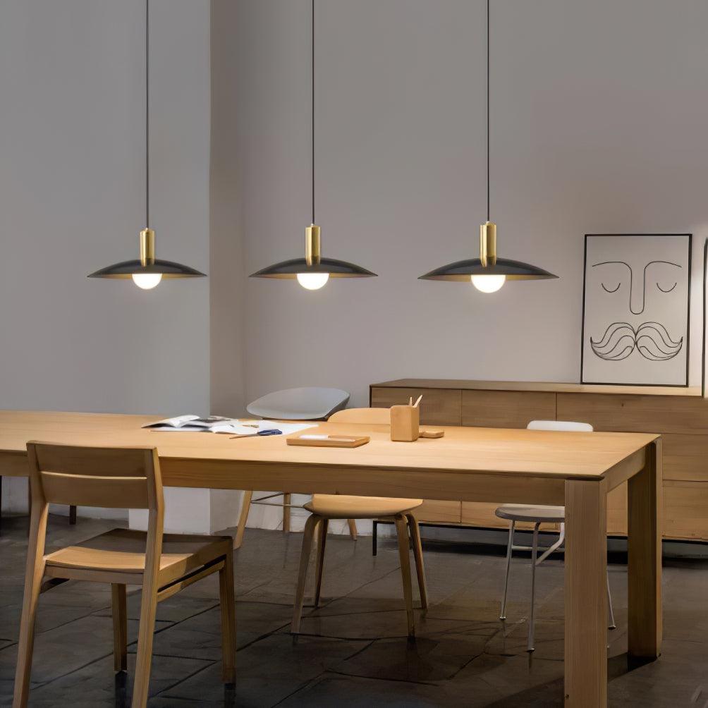 Three black-shade pendants with brass-colour fittings