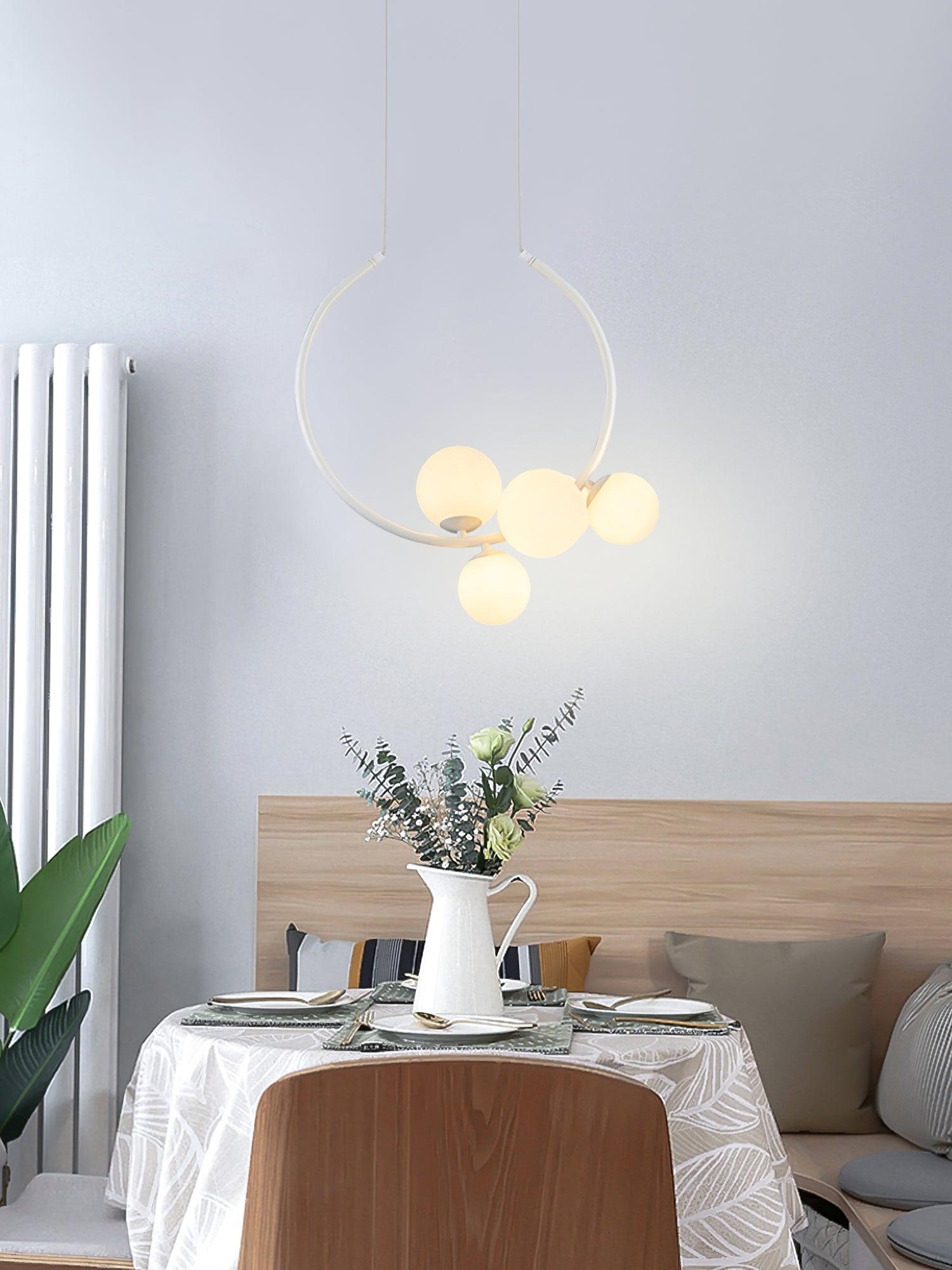 White globe pendant in a bright dining corner