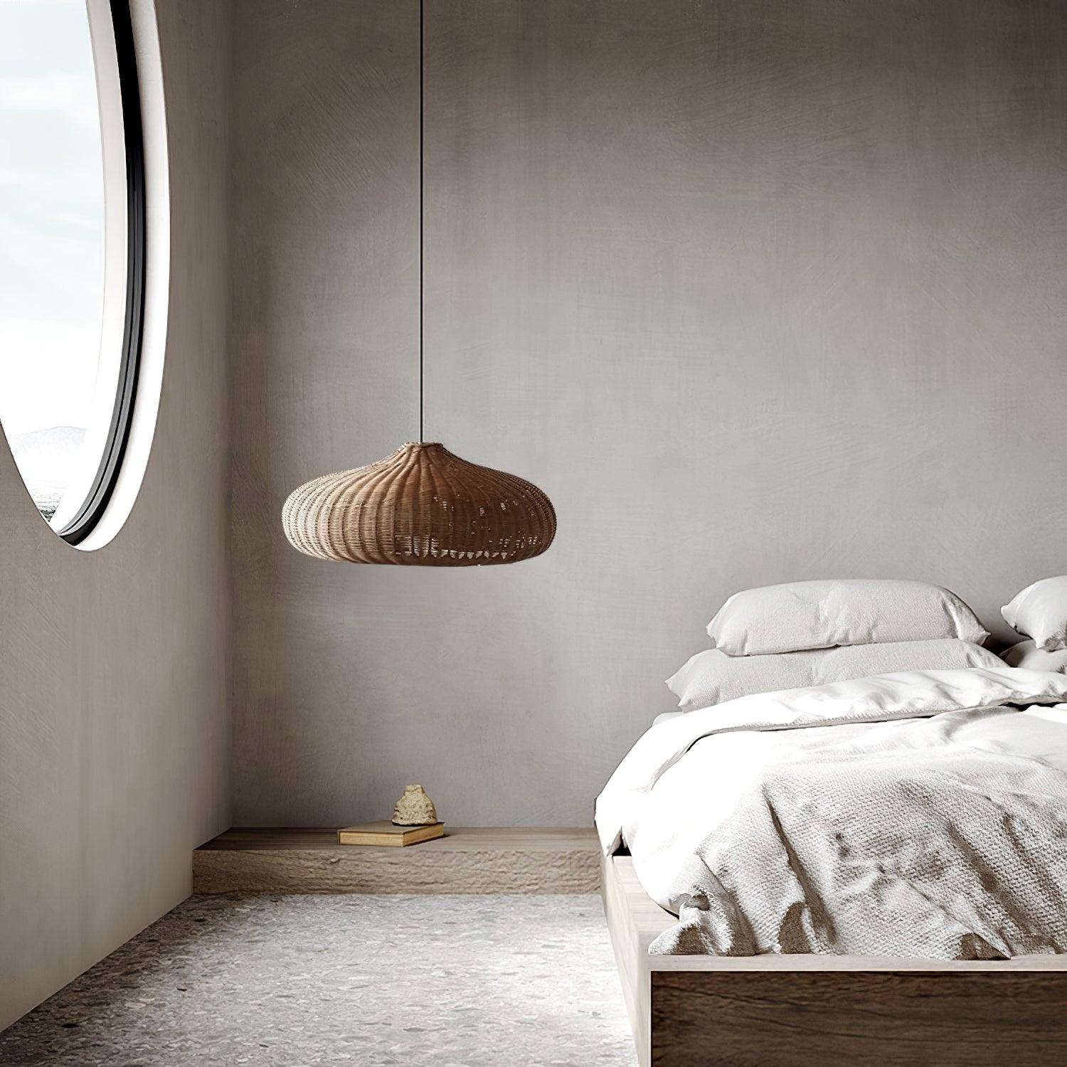 Low woven dome pendant beside a bed