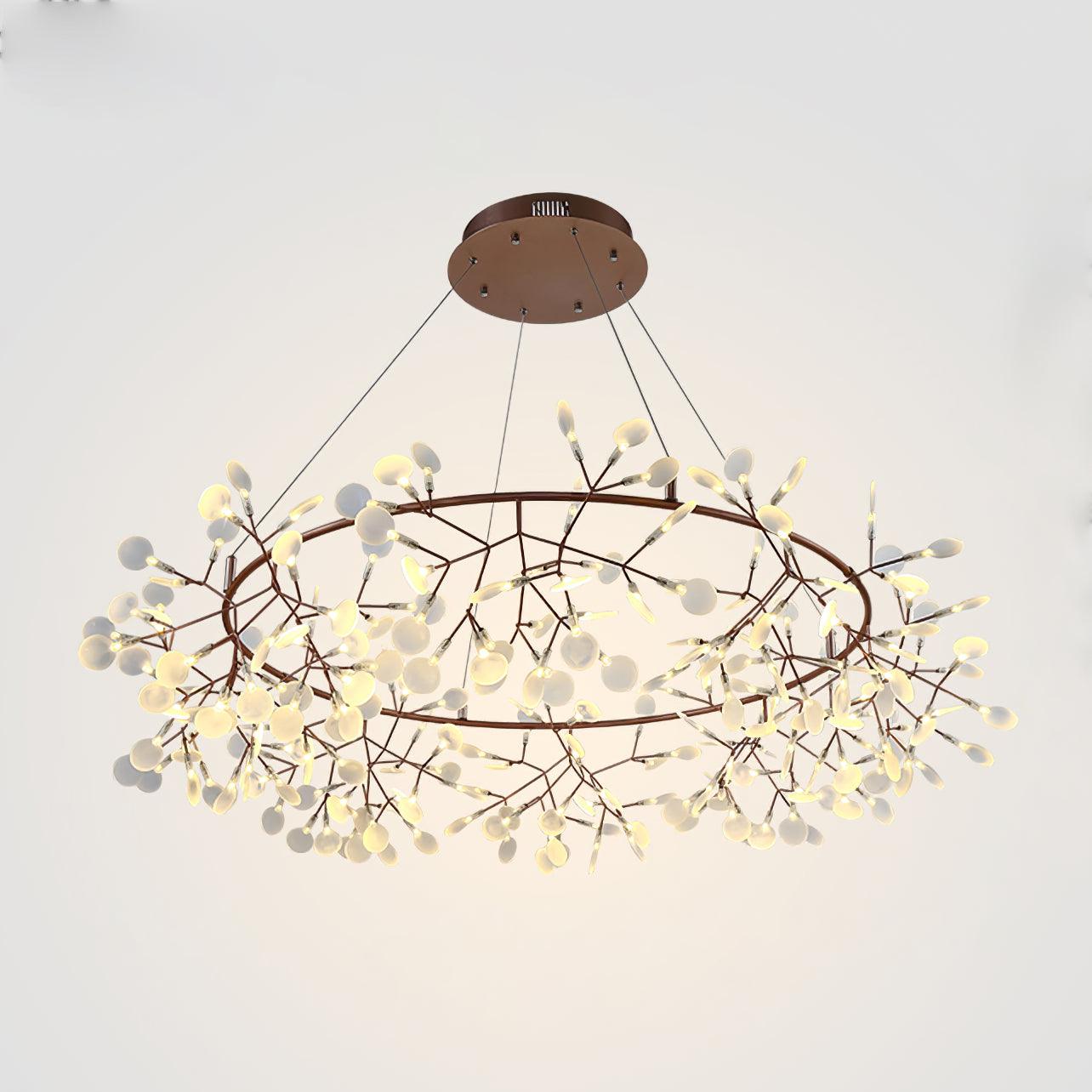 162-head Big O Firefly chandelier viewed from below, showing an open ring and lit white oval leaves