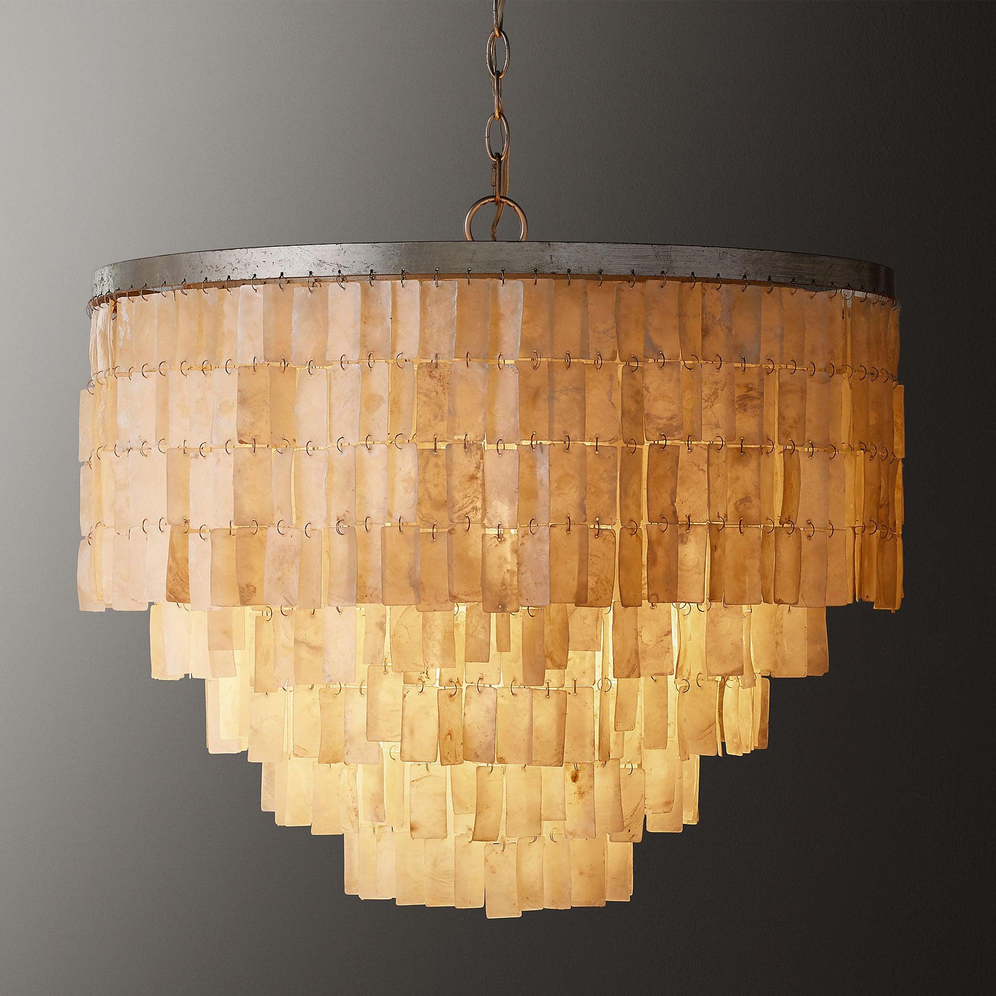 Warm-lit close-up of a deep rectangular shell shade, showing broad upper rows and stepped lower tiers