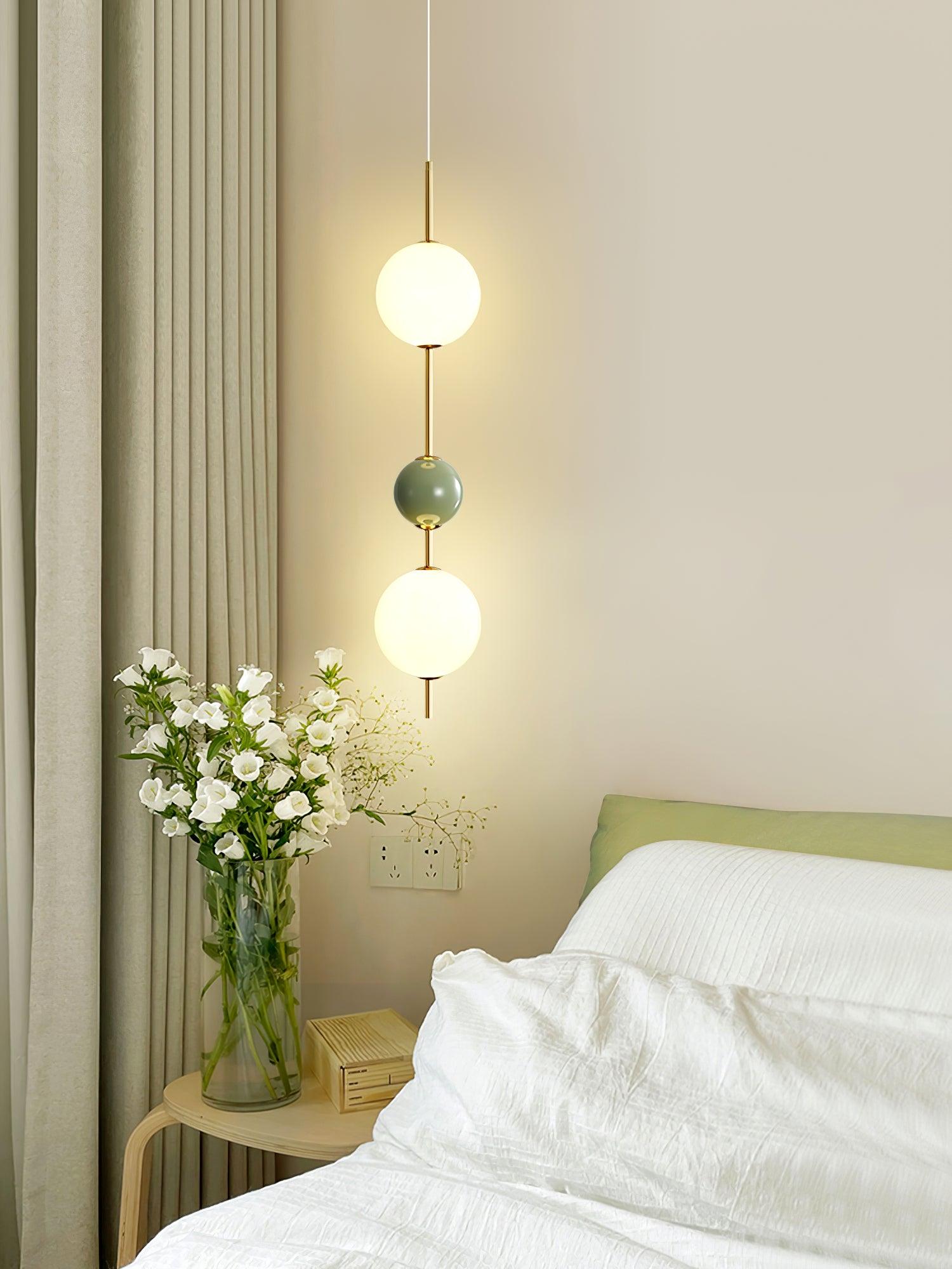 Green three-ball pendant with white upper and lower globes