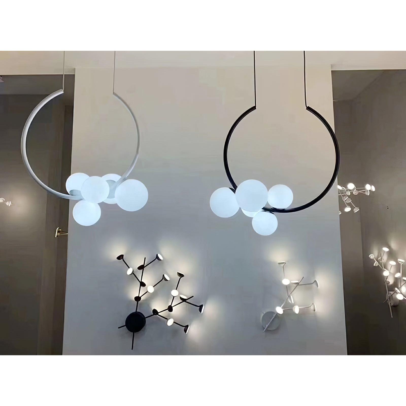 White and Black circular pendants in a lighting showroom