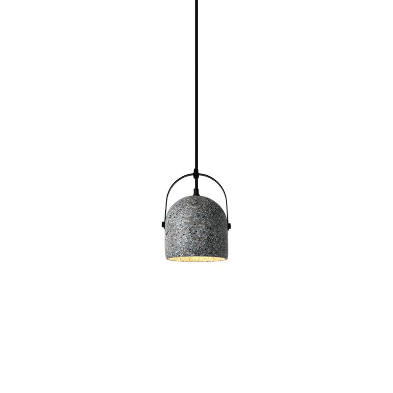 Grey cement pendant with a black arched frame above the shade