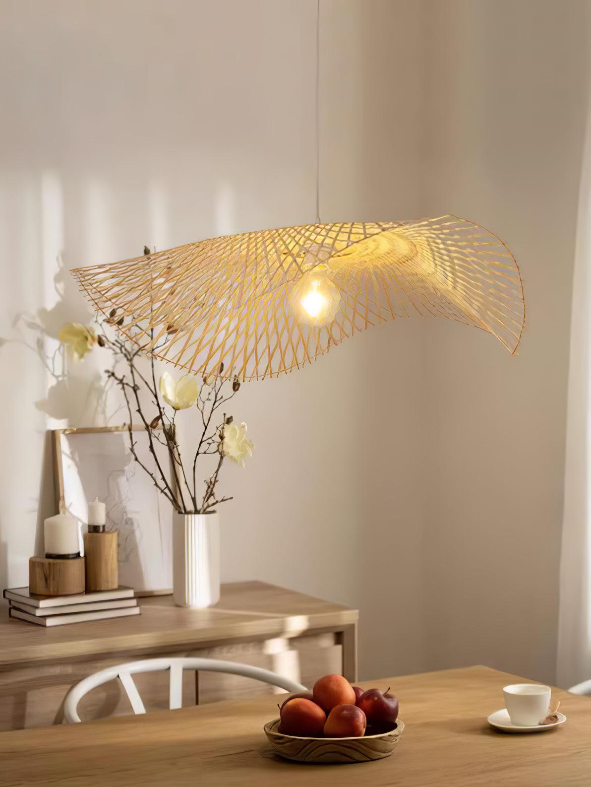 Exposed-bulb bamboo frame above a home dining table