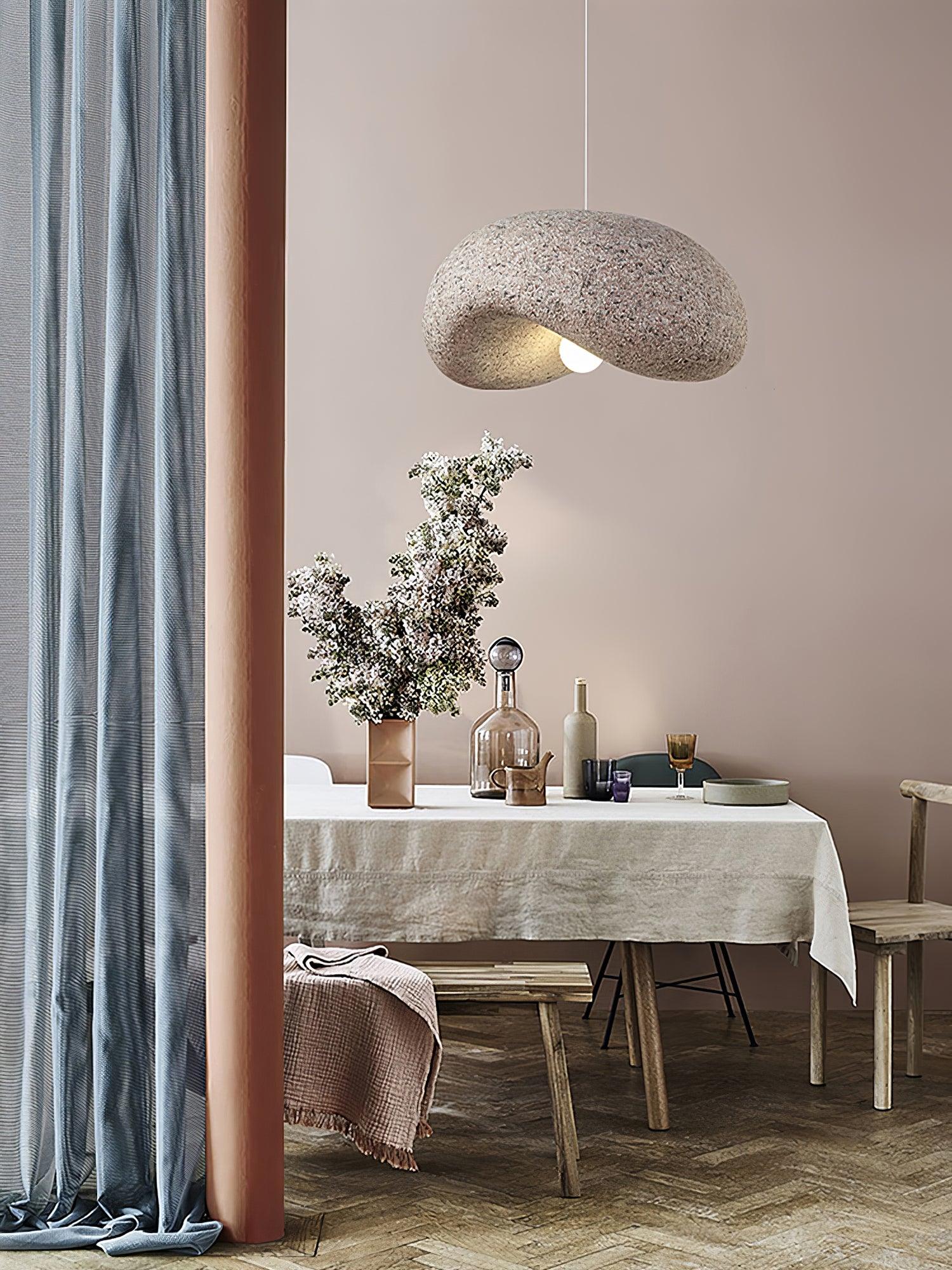 Pink pendant above a dining table