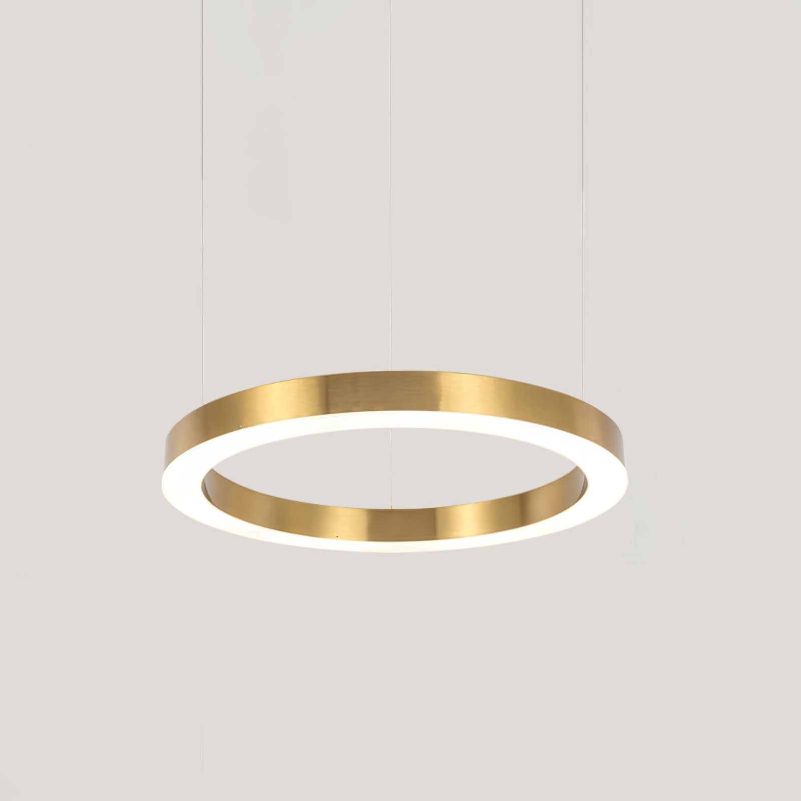 Gold-tone single-ring pendant suspended on fine cables