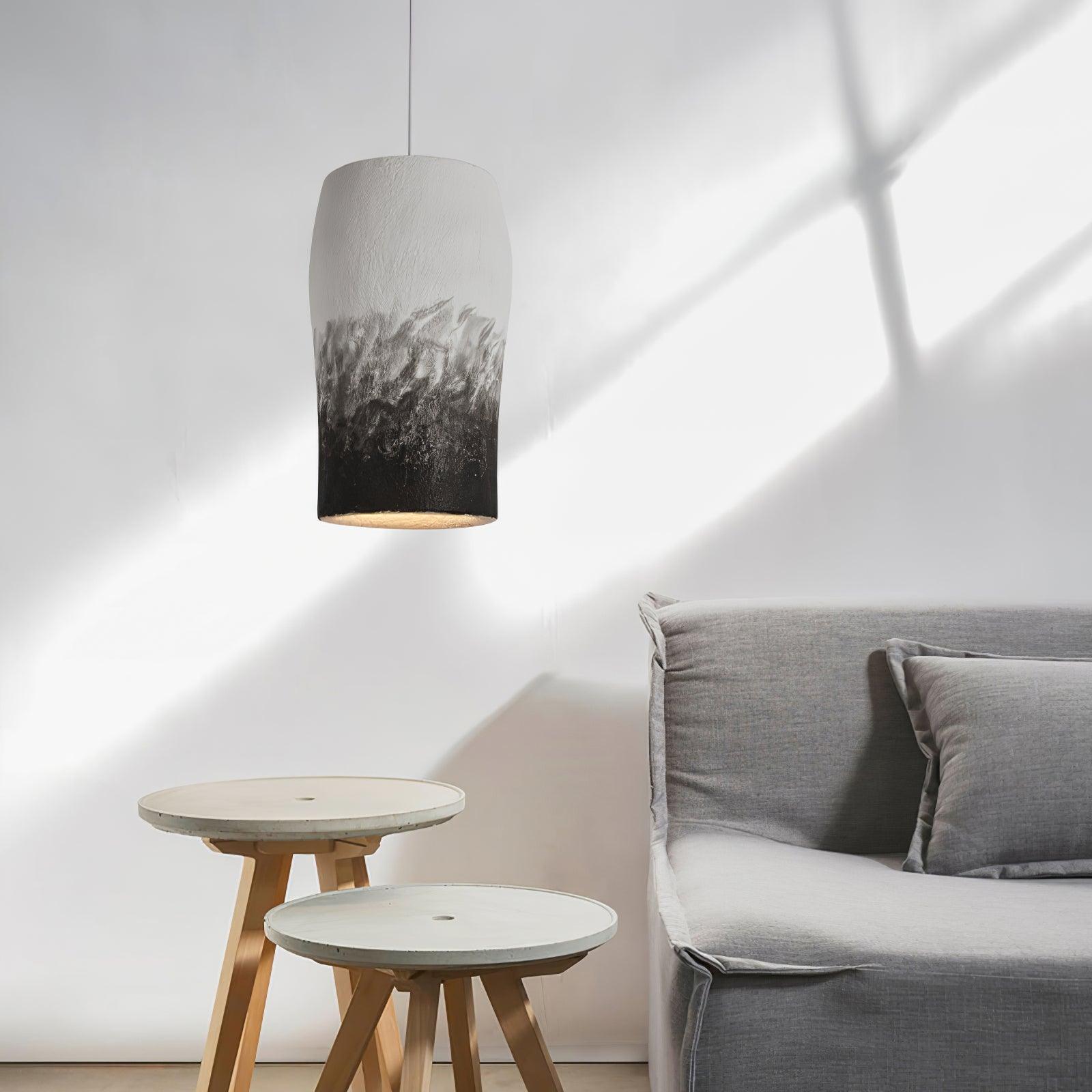 Grey and black shade near a sofa and timber tables