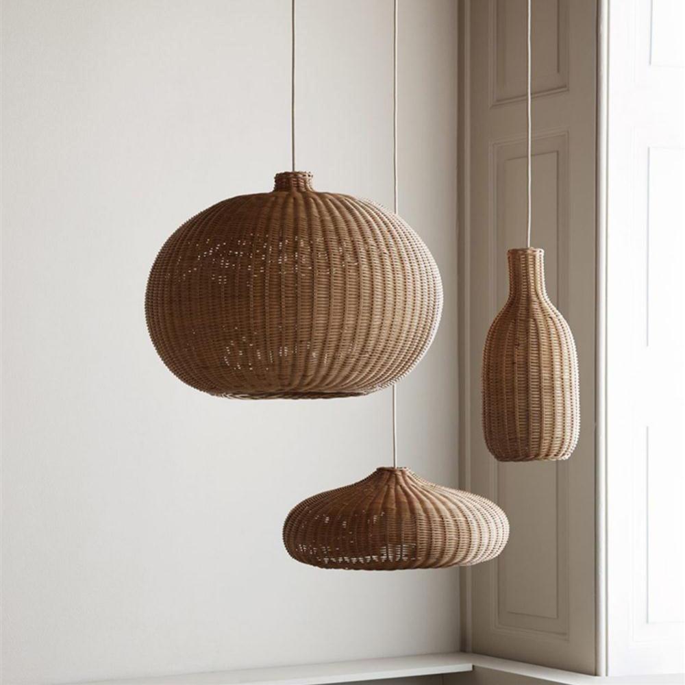 Bottle, low dome and rounded rattan shades grouped indoors