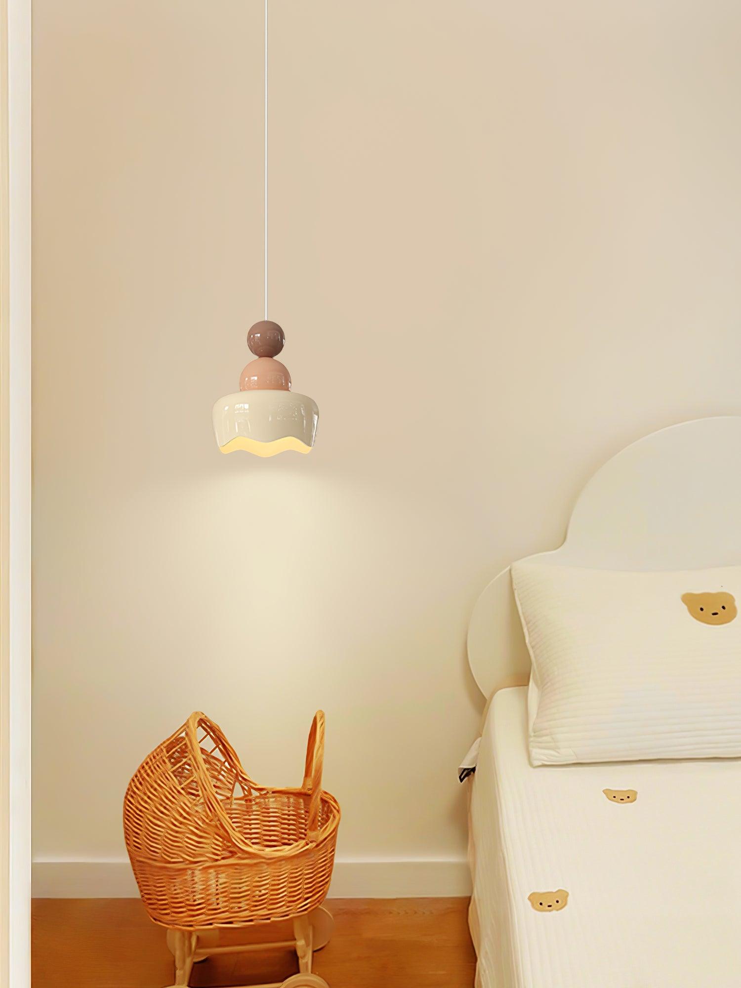 Small pink-and-cream pendant beside an armchair
