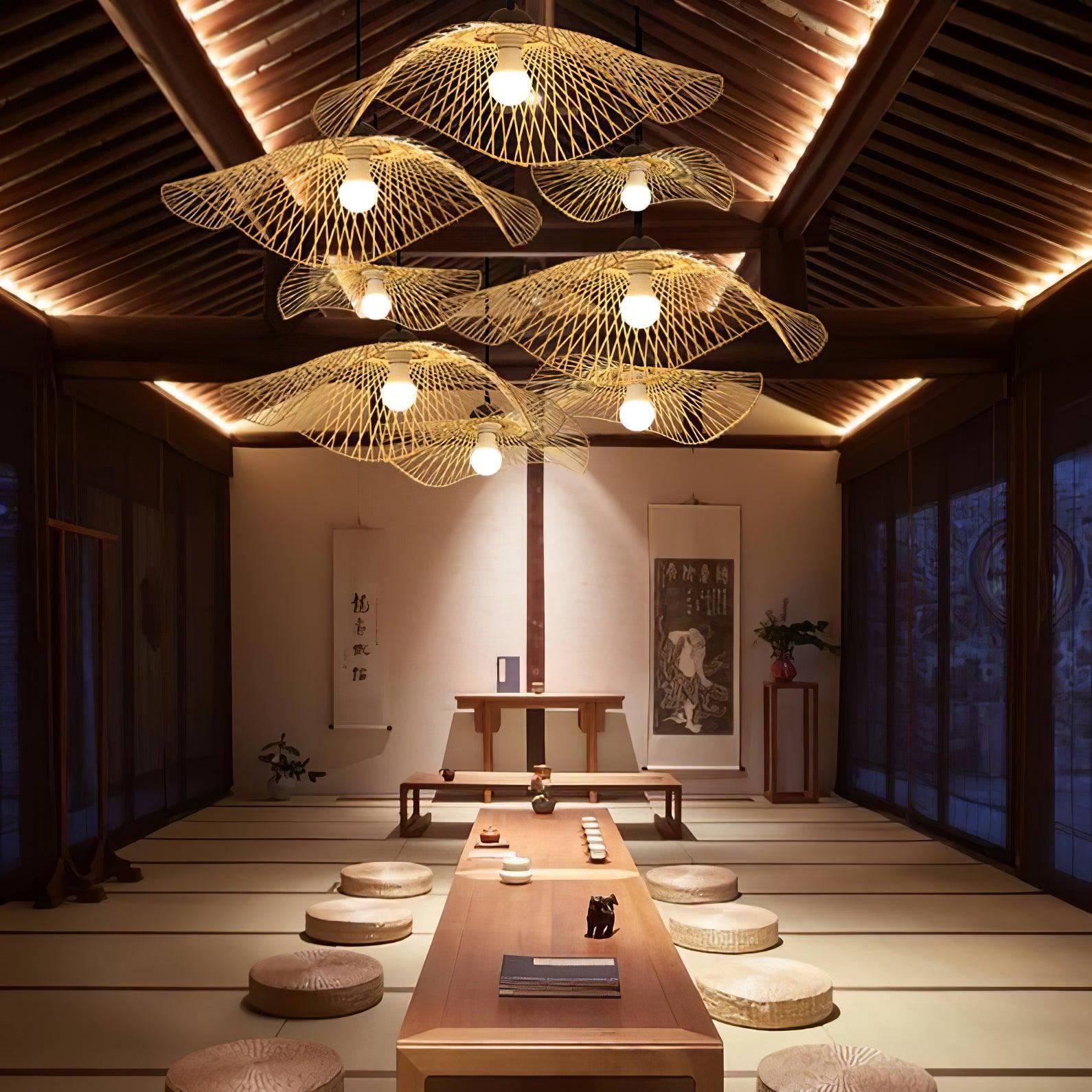 Bamboo pendants above a long low dining table