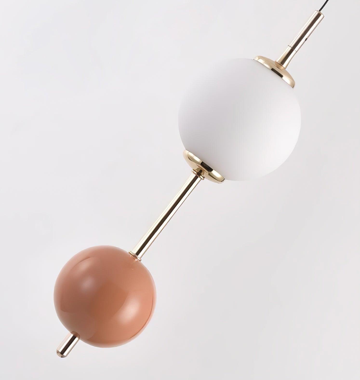 White and orange-brown spheres connected by a Gold-finish rod