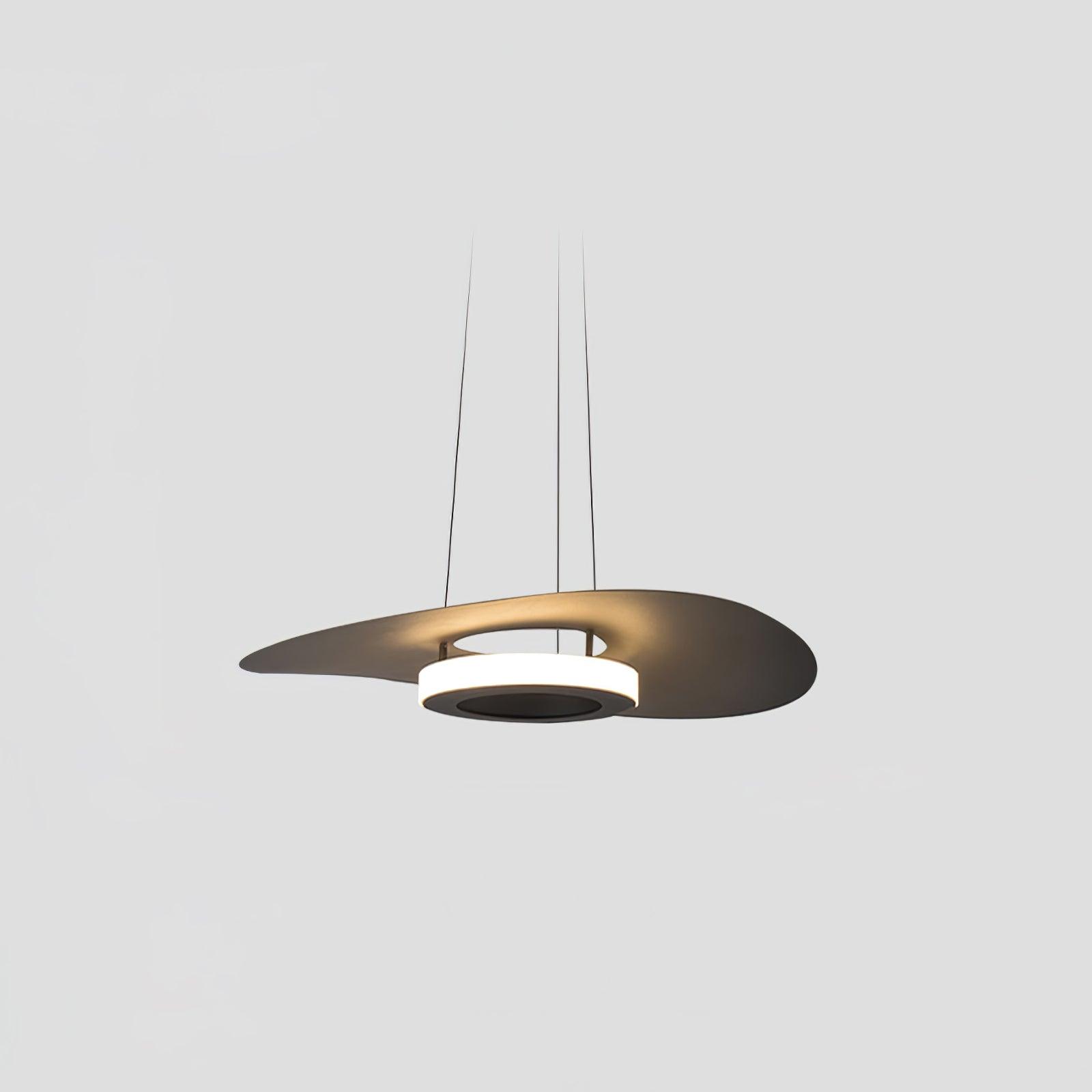 Dark curved disc and lower luminous ring with long thin suspension lines on a pale background